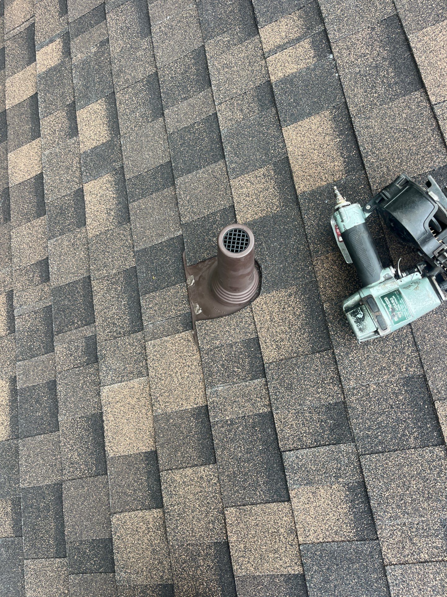 Brown brick with IKO Shadow Brown by Tejas Roofworks + Restoration