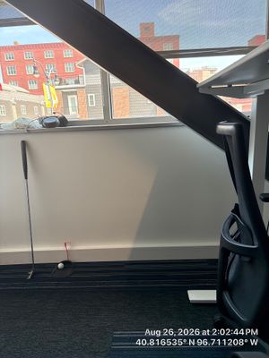 Modern Lincoln Office Setup with Integrated Indoor Putting Area