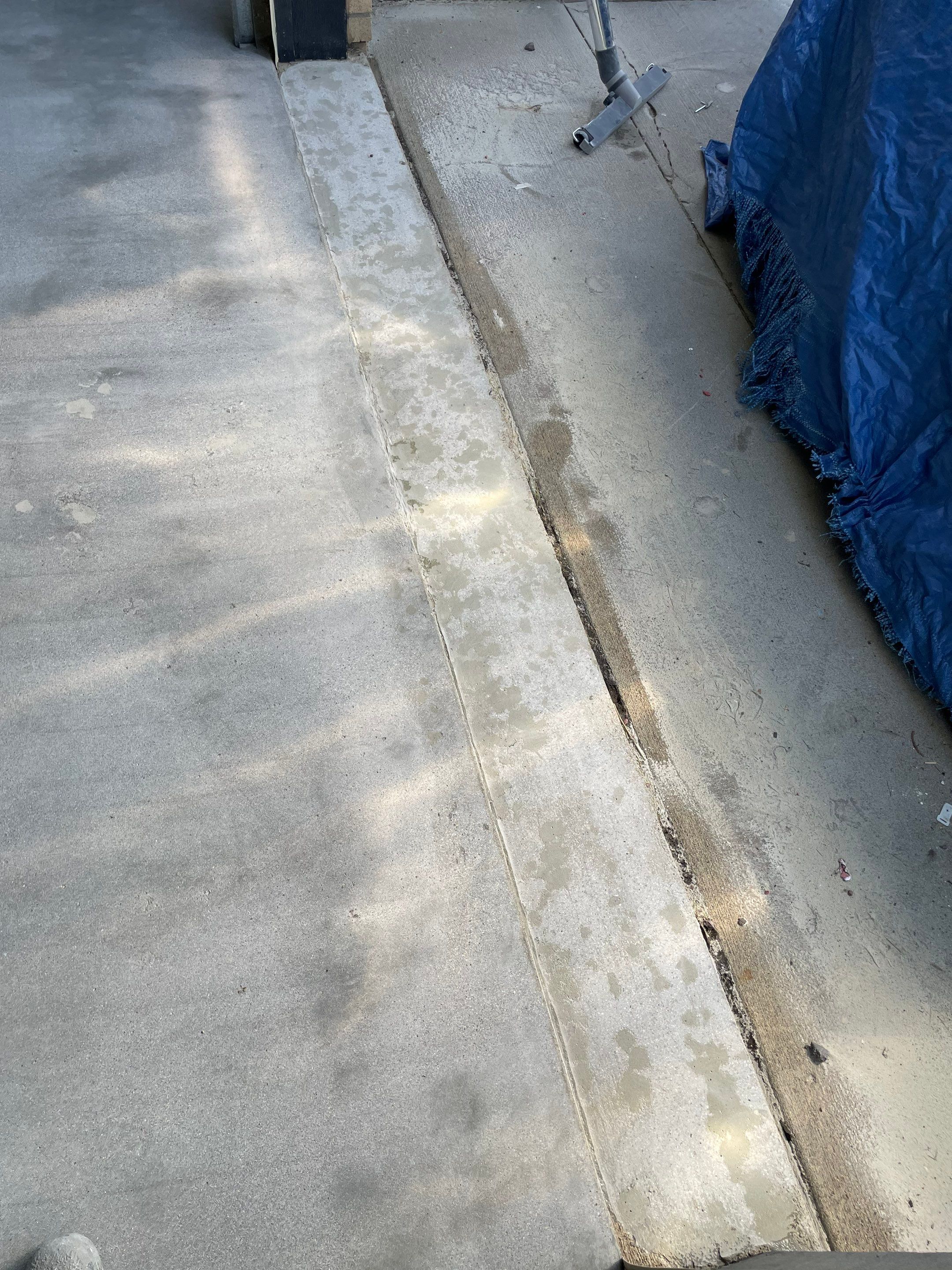 Cabin FEver Flake Garage Floor Coating Installation in Sioux Falls by Select Painting, Coatings & Garage Cabinets