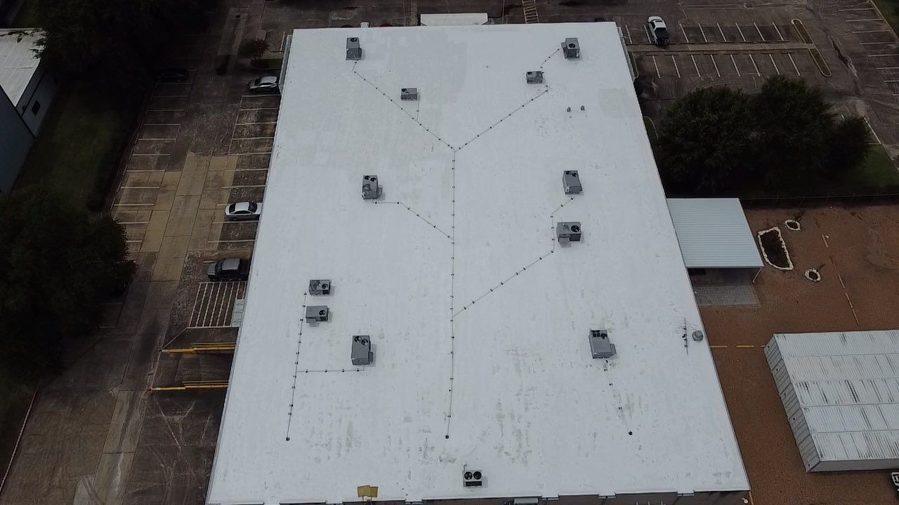 Flat Roof Coating Installation by Houston Roofing & Construction