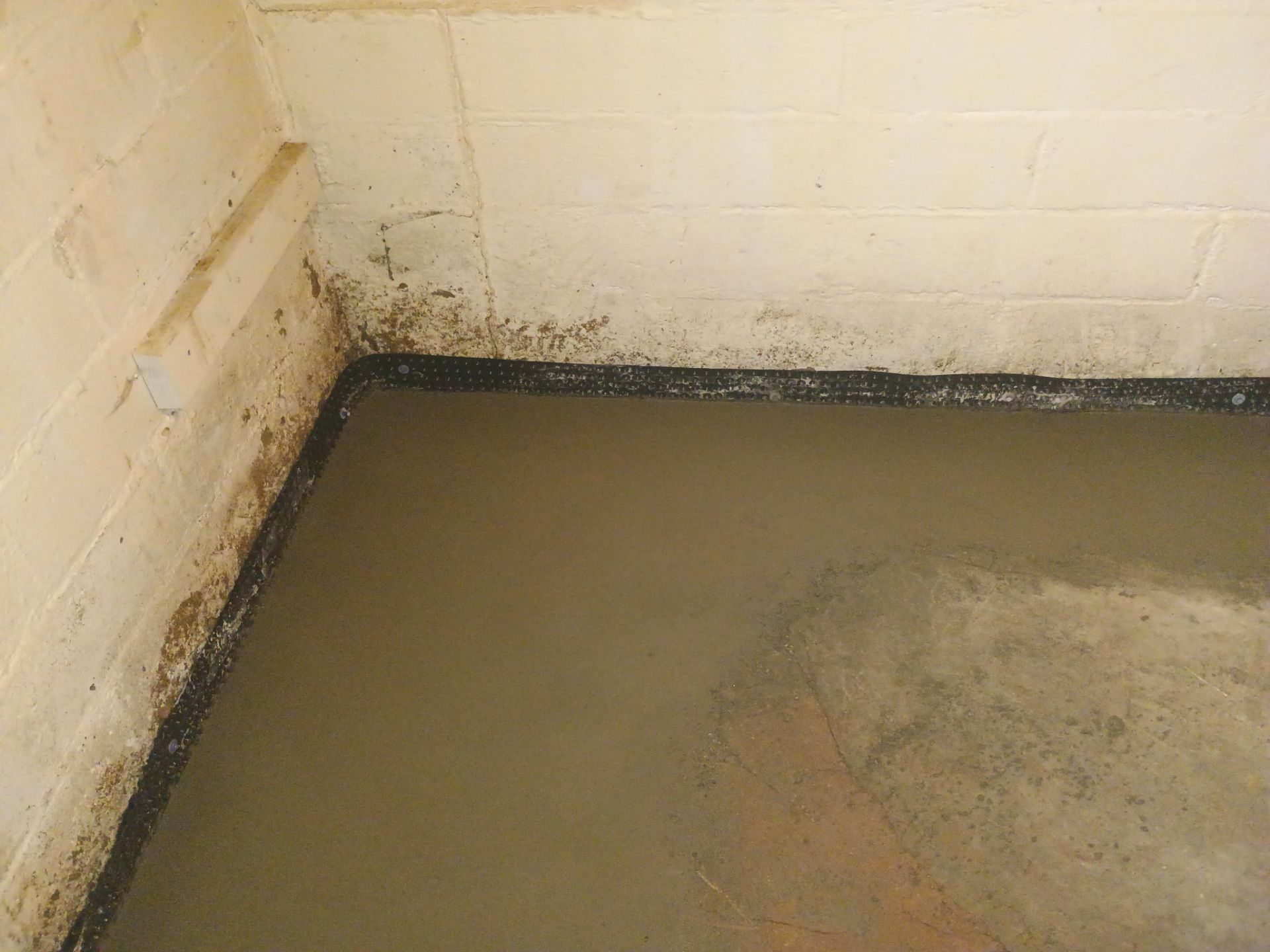 Interior Drain Tile & Sump Pump System in North Minneapolis by Waterproofing Northeast