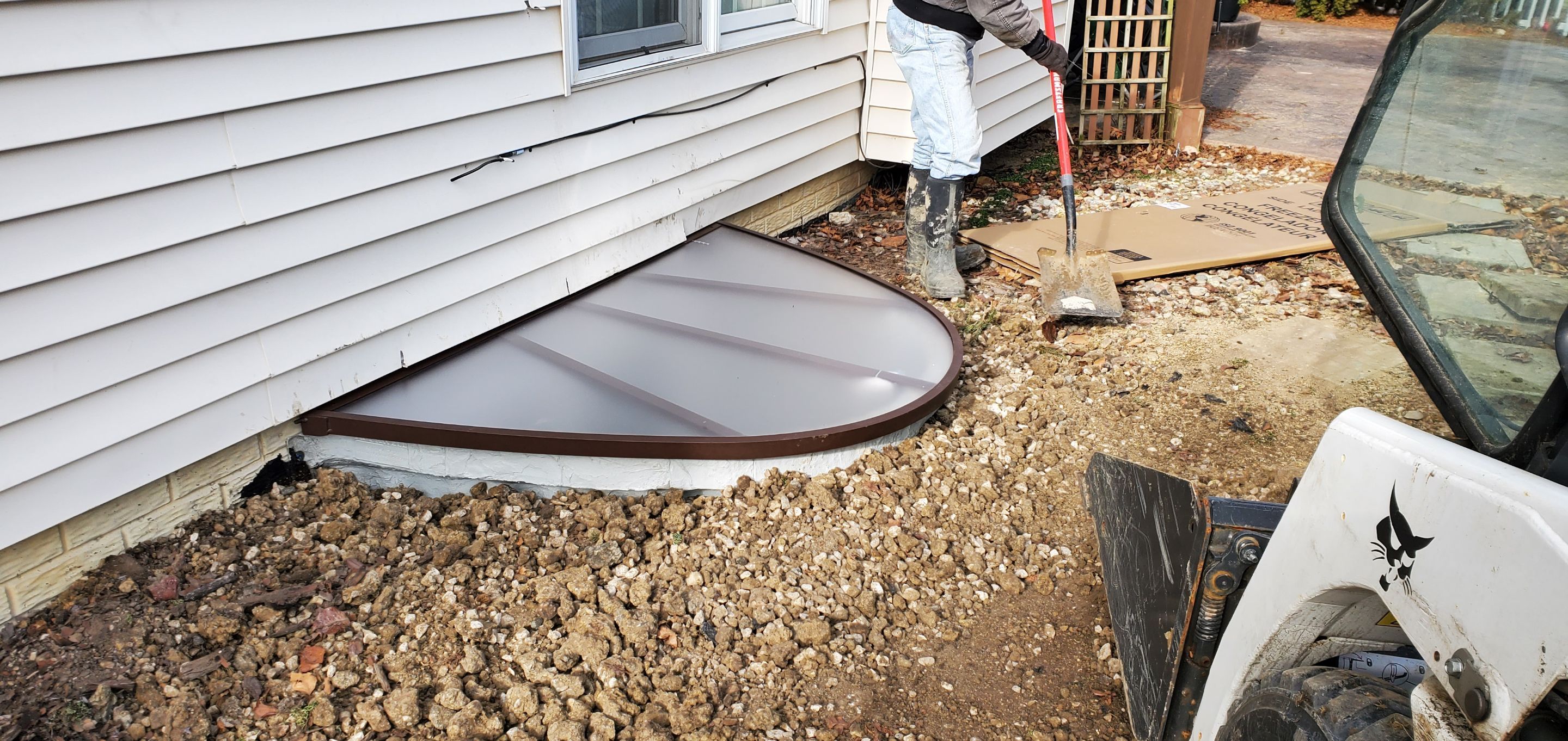 Egress Window Installation using Rockwell Egress Fiberglass Egress Window Well by Toledo Basement Repair 