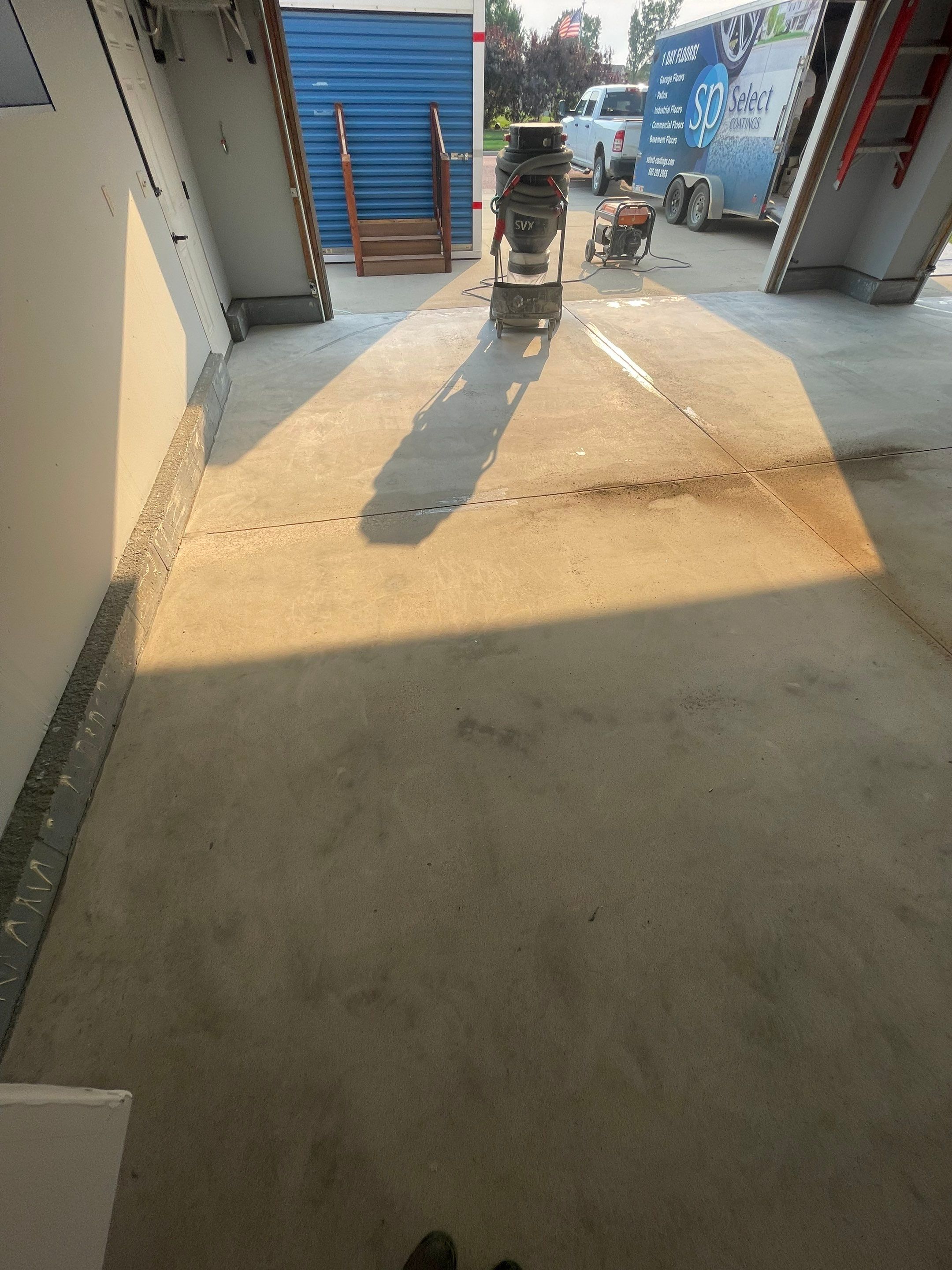 Sioux Falls Garage Concrete Coating Installation with Domino Flake by Select Painting, Coatings & Garage Cabinets