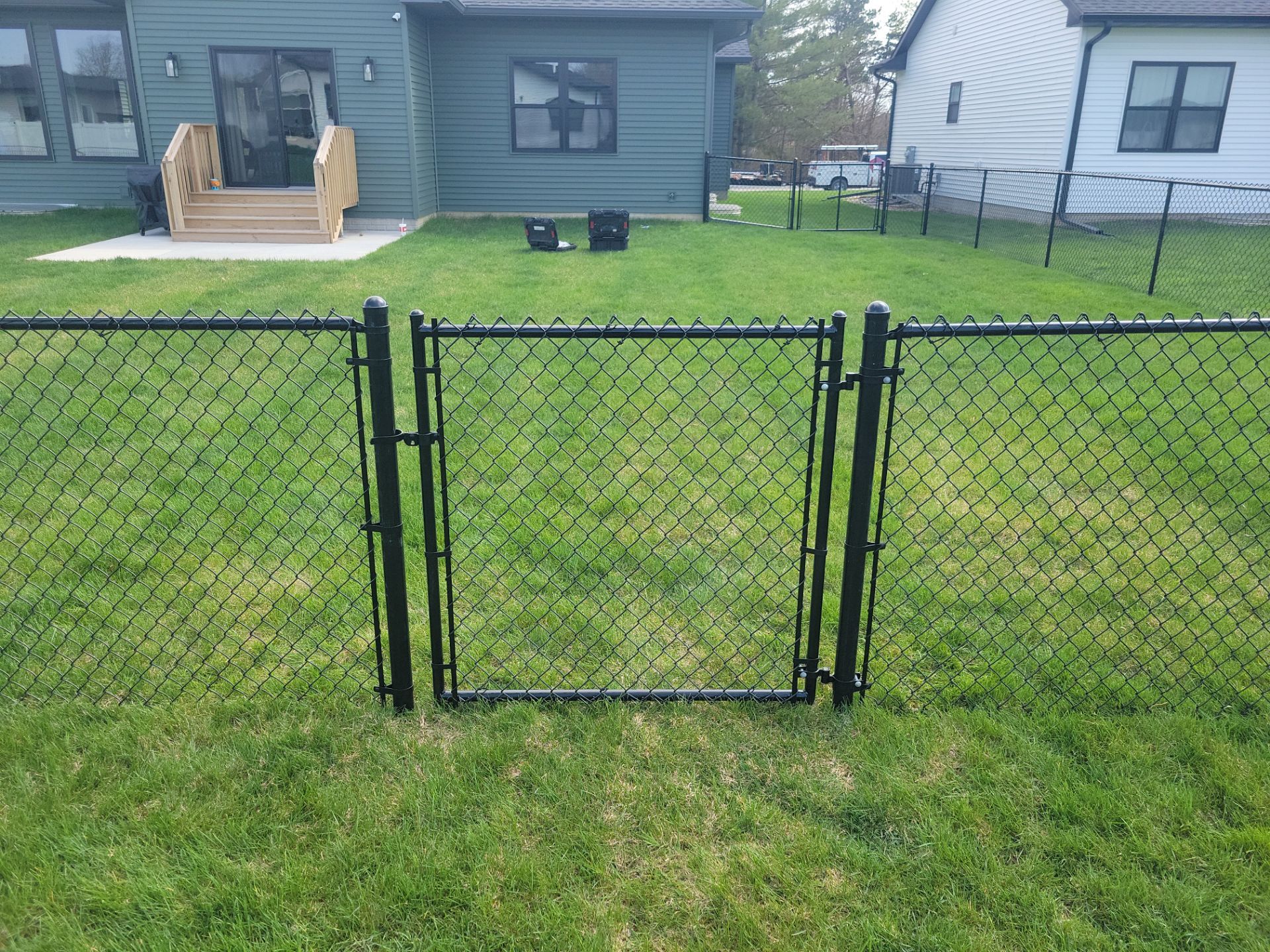 Black Chain Link Fence and Gate Installation in Cedar Falls by Perfect Picket Fence and Stain