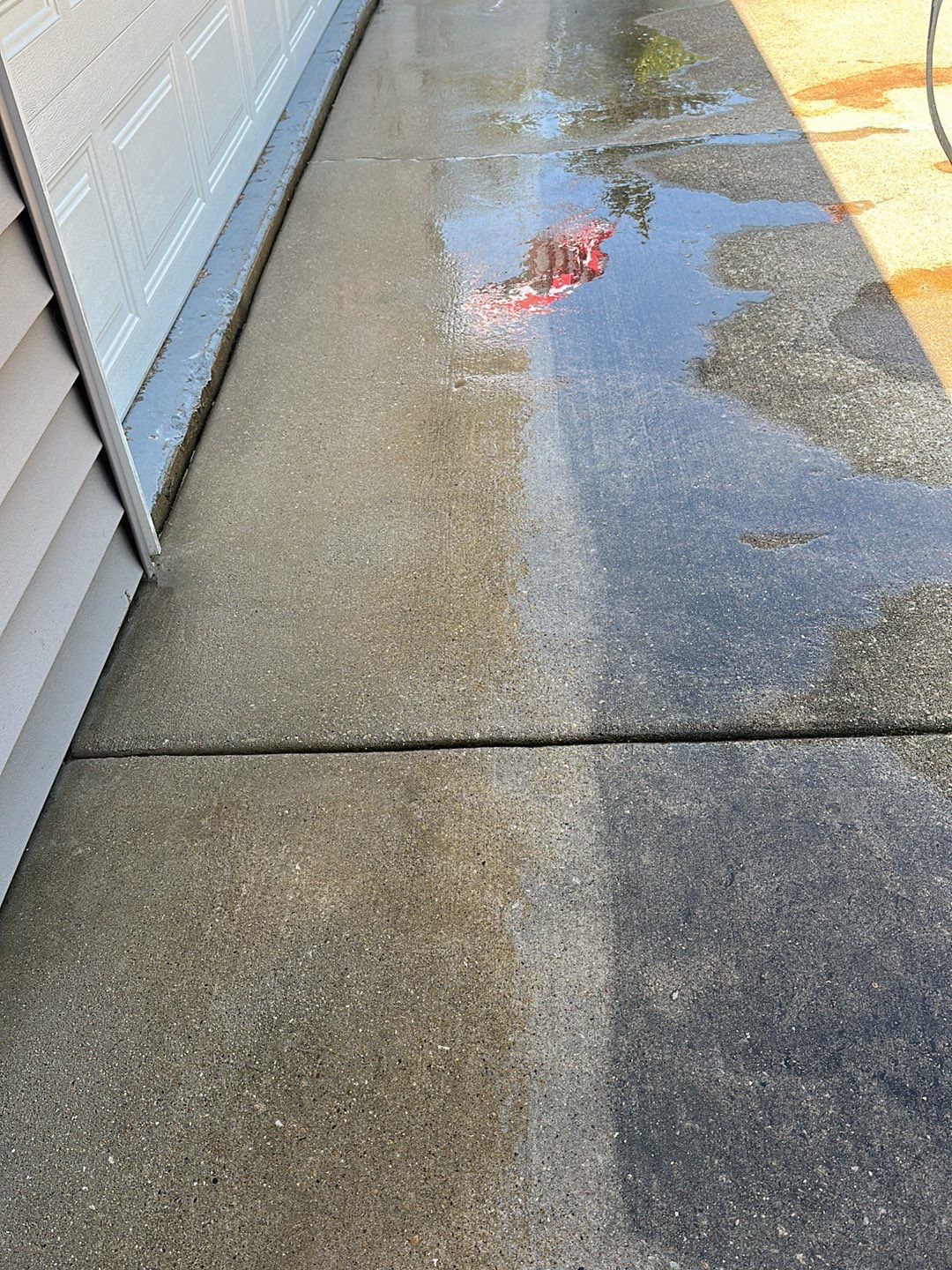 Oil extraction from concrete driveway.  by Northern Power Washing LLC.