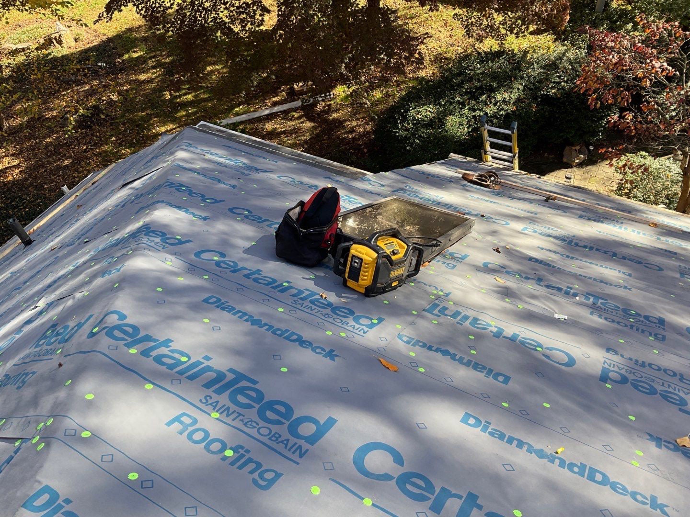Install new shingles and new skylights  by Alpha Design Services
