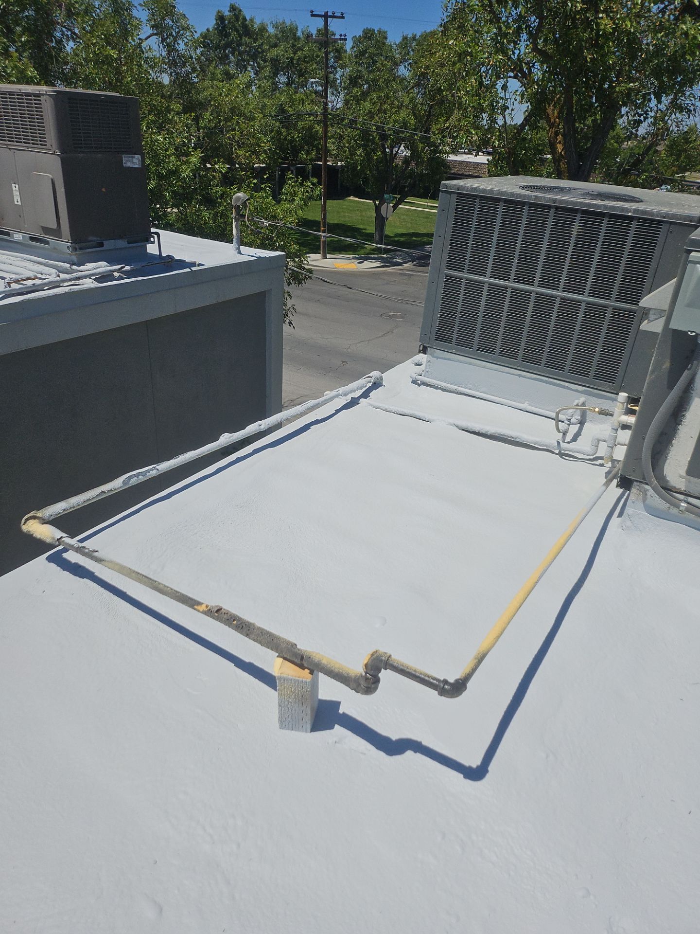 Foam Refurbish using General Coatings acrylic coatings and spray foam by Straight Edge Roofing Inc