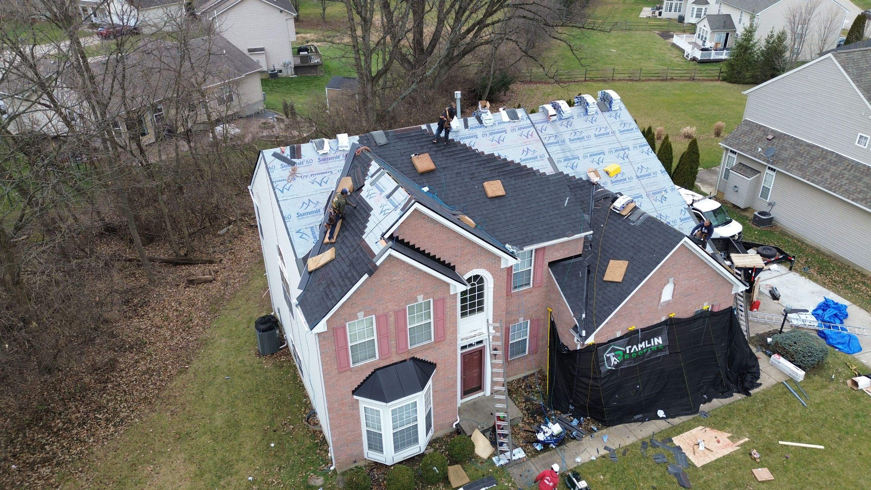 Walden Ponds - Pristine Black and Hydro Flo Gutter Guards by Tamlin Roofing