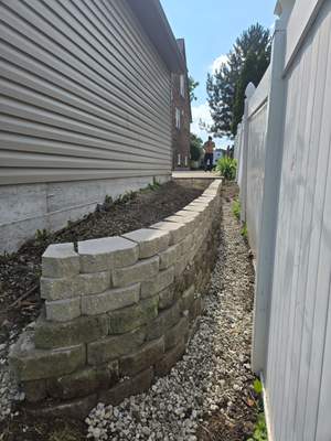 Split faced landscape block retaining wall and French Drain Installation