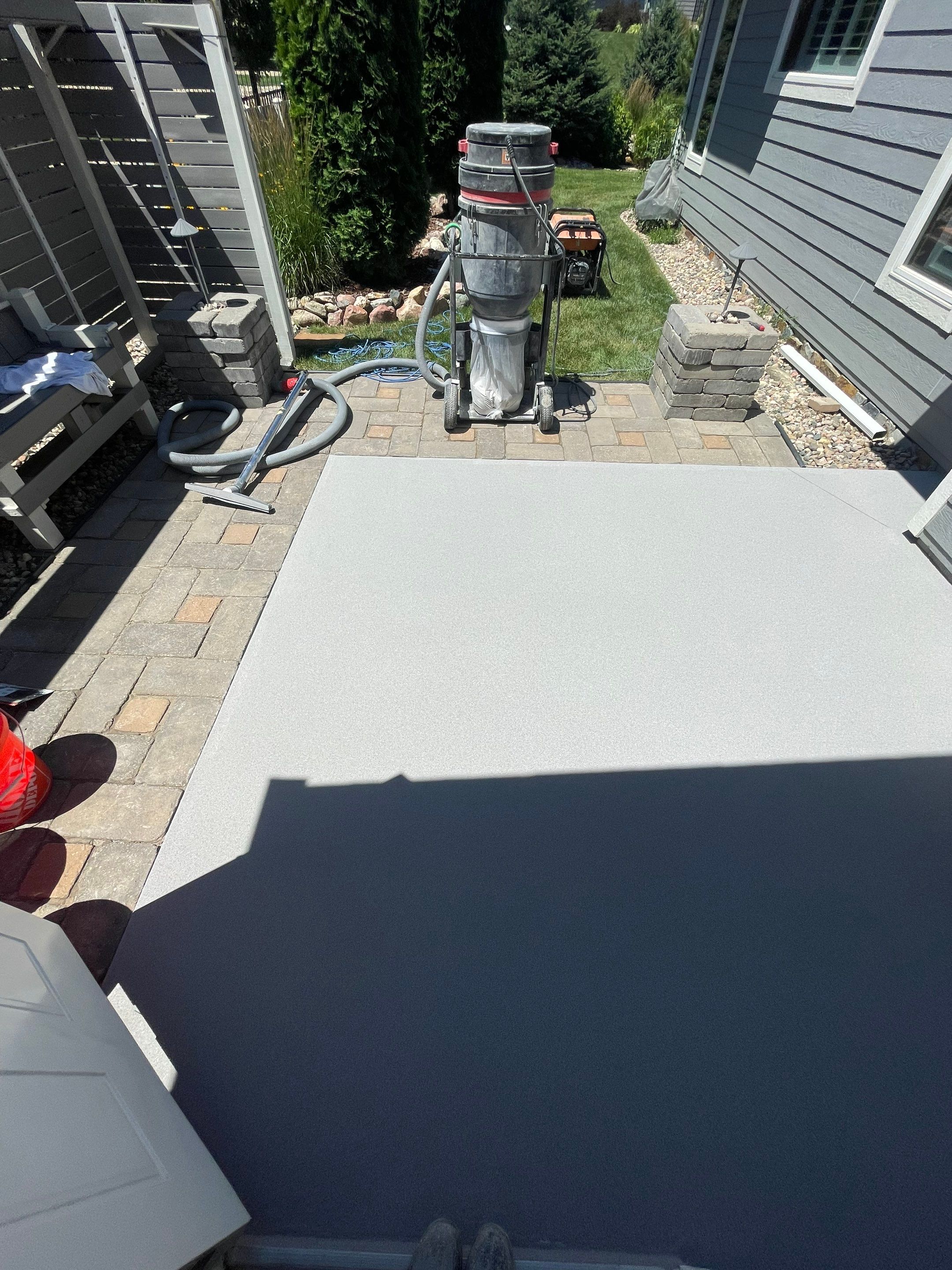 Concrete Patio Coating with Fuzzy Wool Finish in Sioux Falls by Select Painting, Coatings & Garage Cabinets