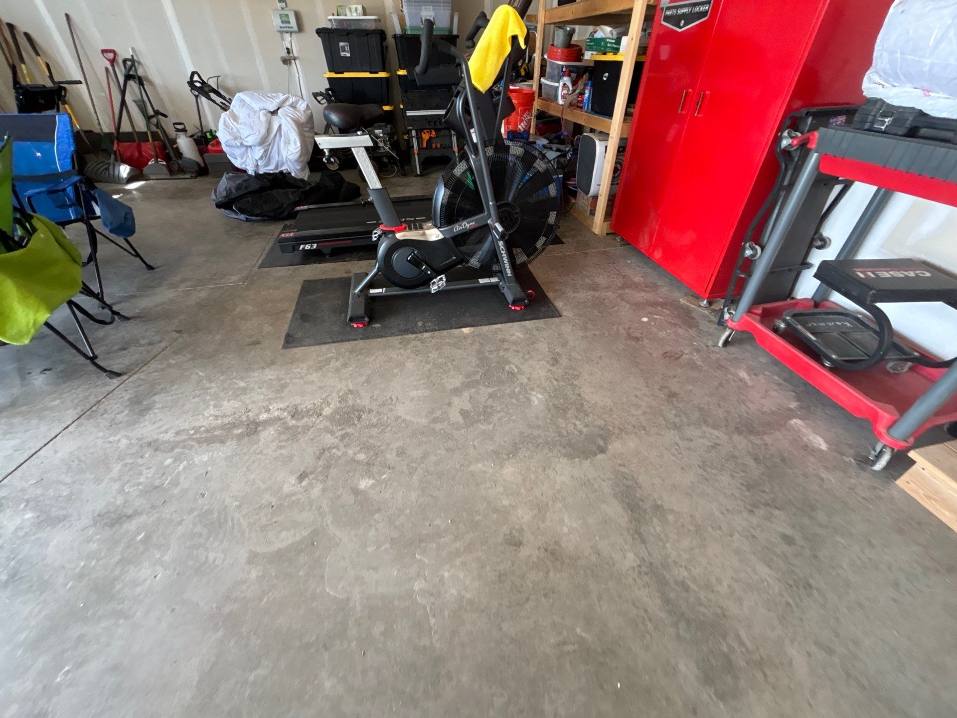Grey Flake Epoxy Garage Floor Coating in Sioux Falls by Select Painting, Coatings & Garage Cabinets