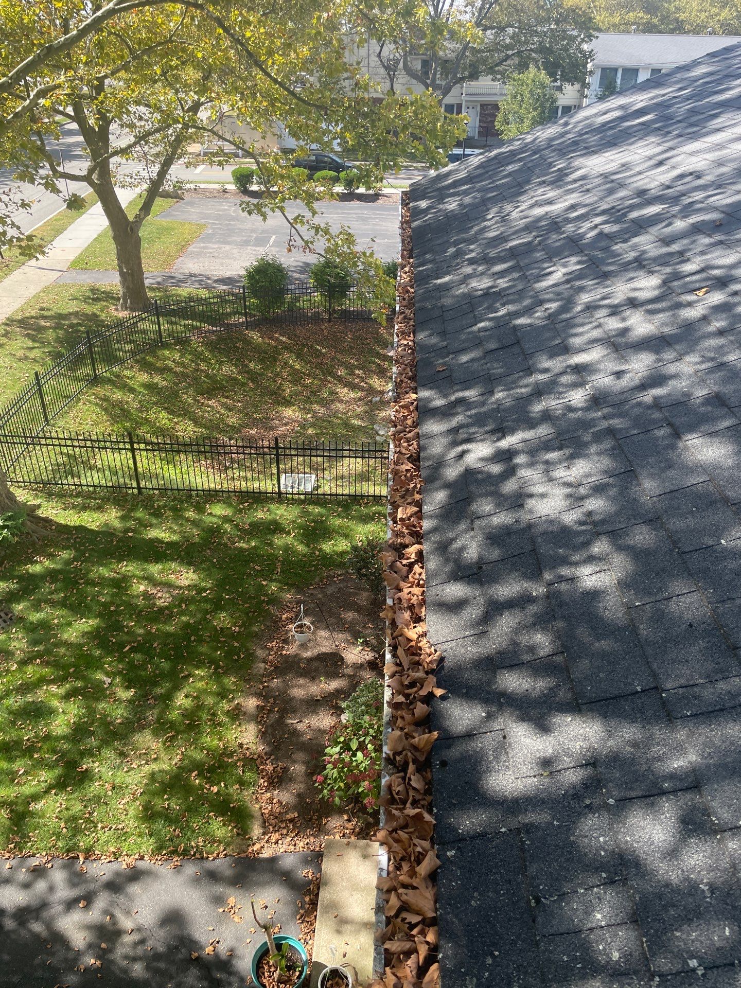 Commercial gutter cleaning Rhode Island before photo with filled gutters