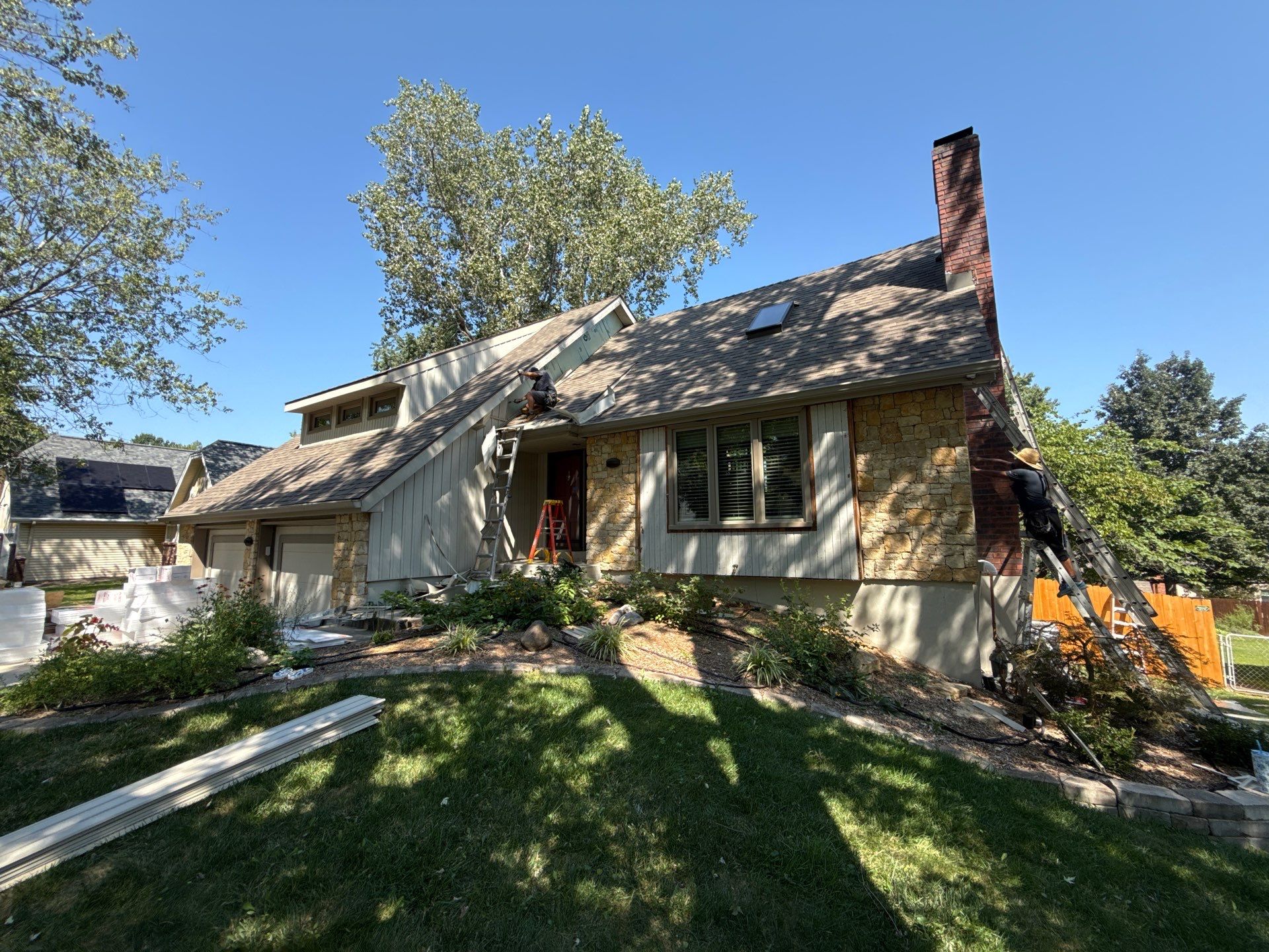 Comprehensive Kansas City Exterior Remodel Featuring Board And Batten Siding by EEC Windows, Siding & Roofing
