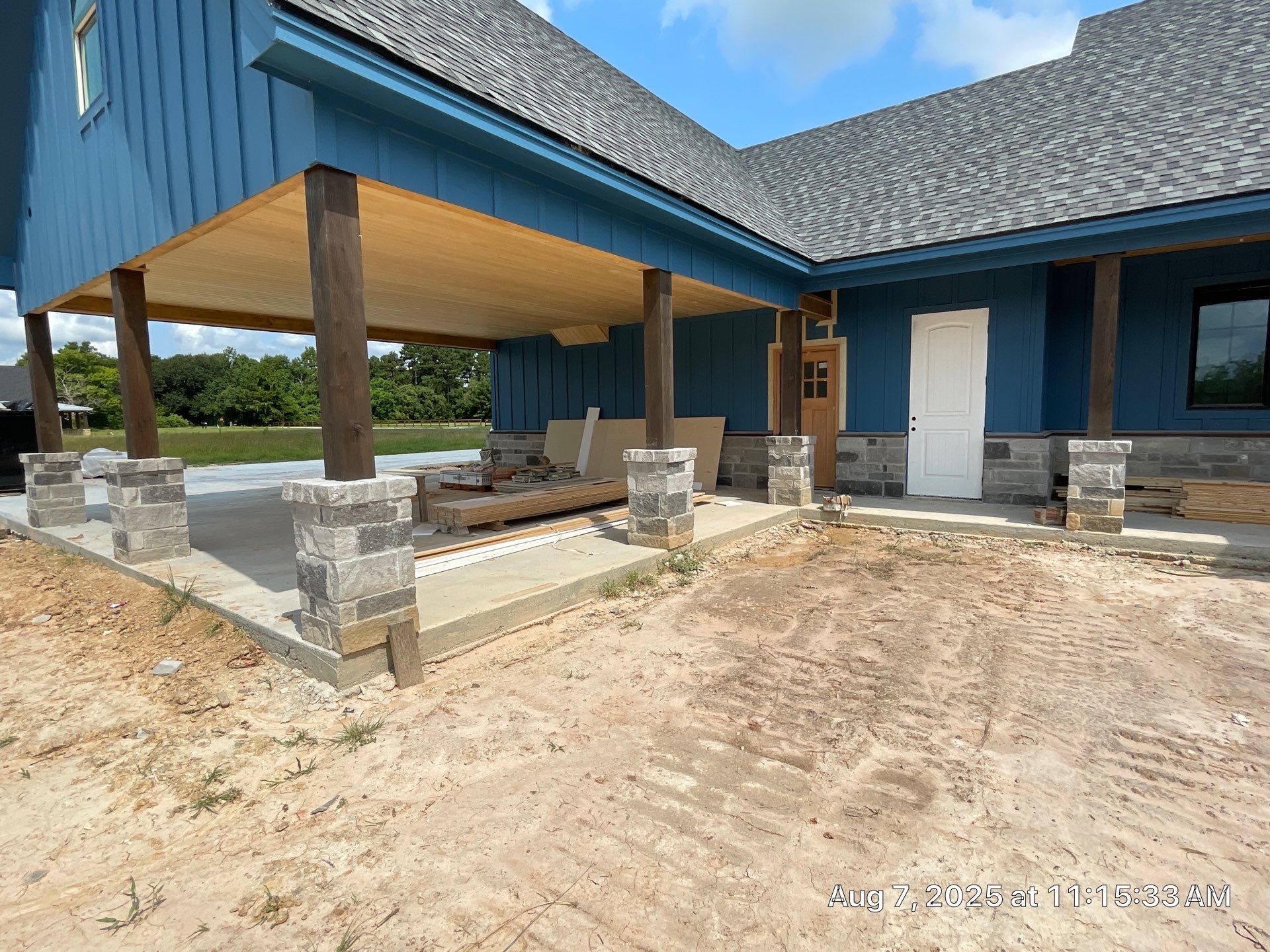Natural Stone Elegance: Apex Installation Accented by Blue Siding by Apex Conventional Stucco Llc