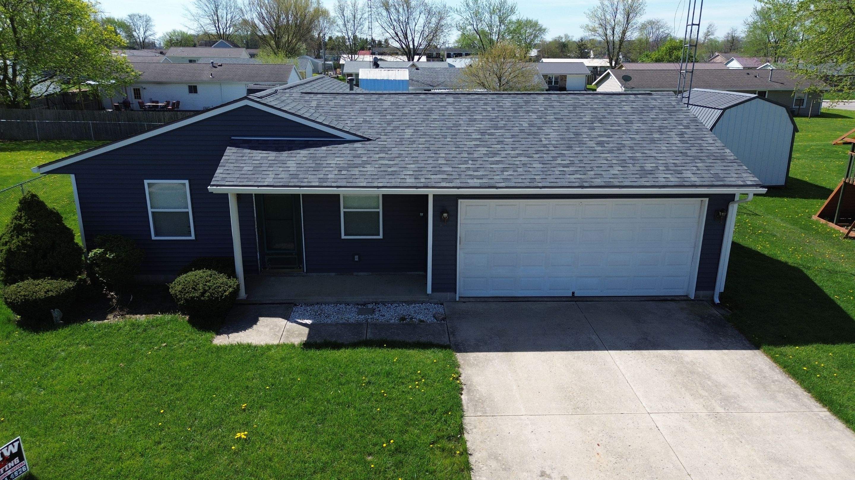 Storm Damage Residential Roof and Siding Installation by WIW Enterprises Inc