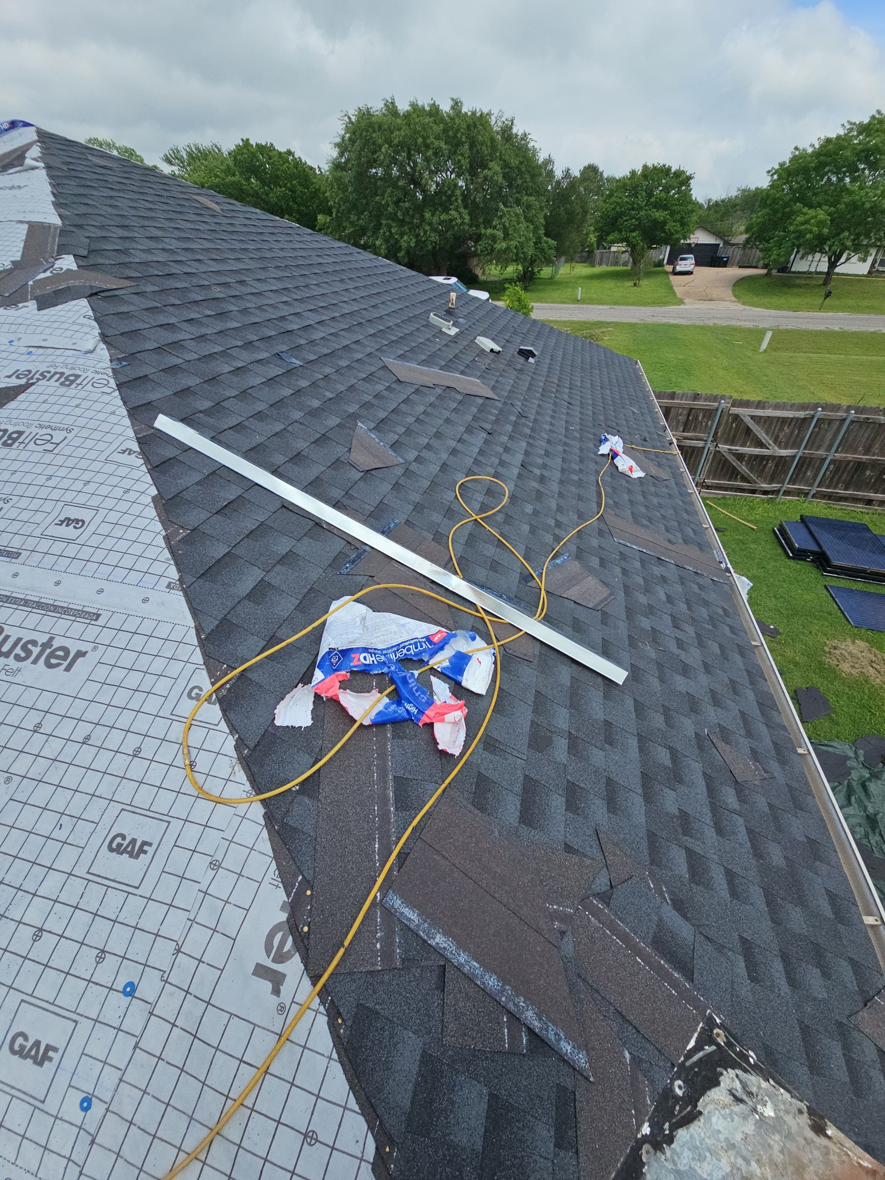 "Full Roof Replacement Due to Hail and Water Damage – Before & After" by road roofing llc