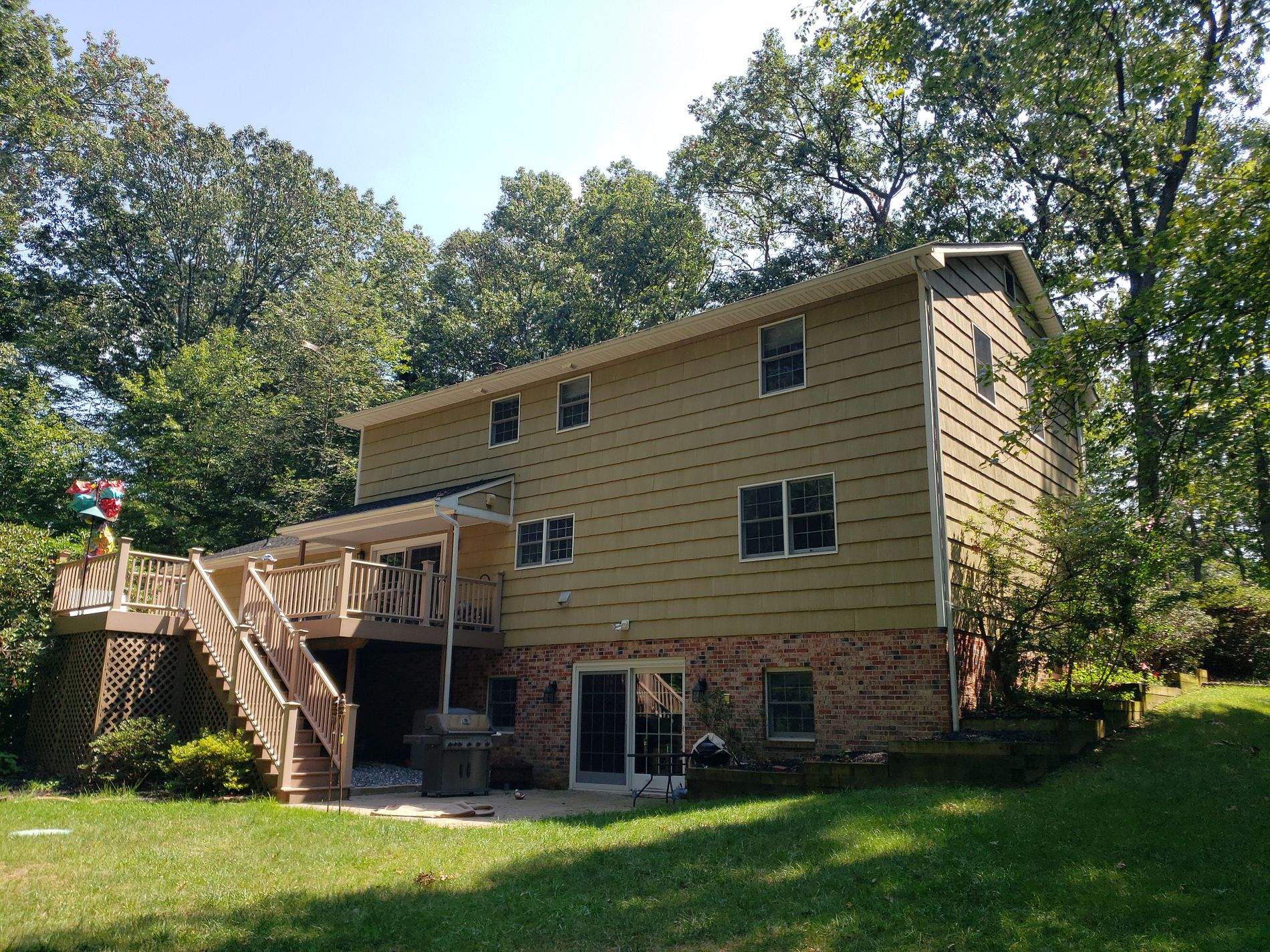 White Board & Batten Siding with Black Trim by Roof Right Inc