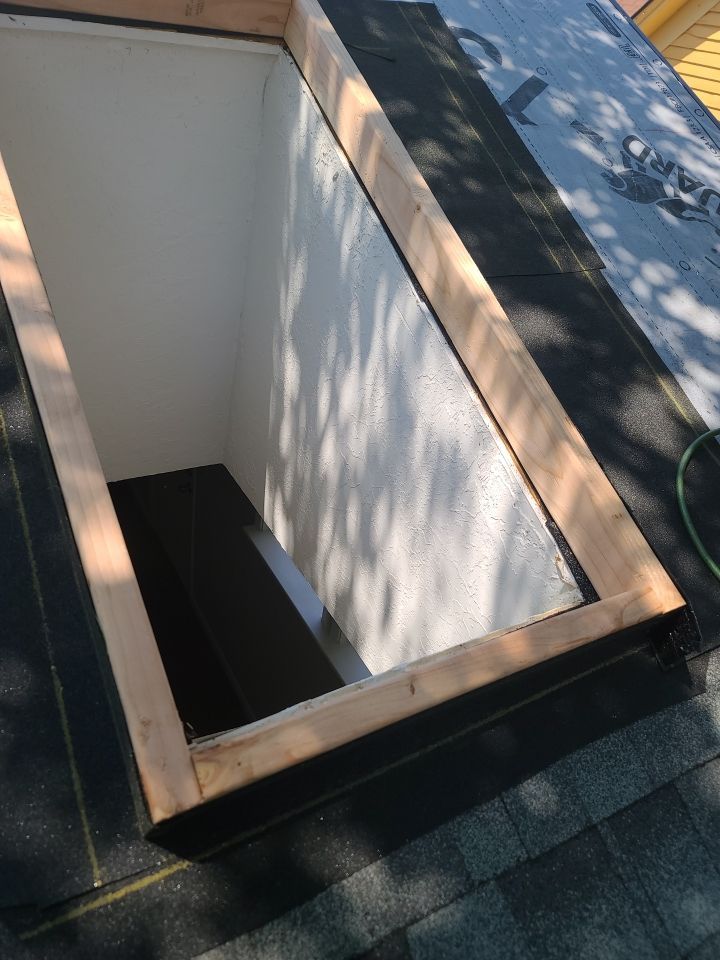 Impact Resistant Roof Replacement and Skylight Project in Norman Oklahoma by McCann's Roofing and Construction