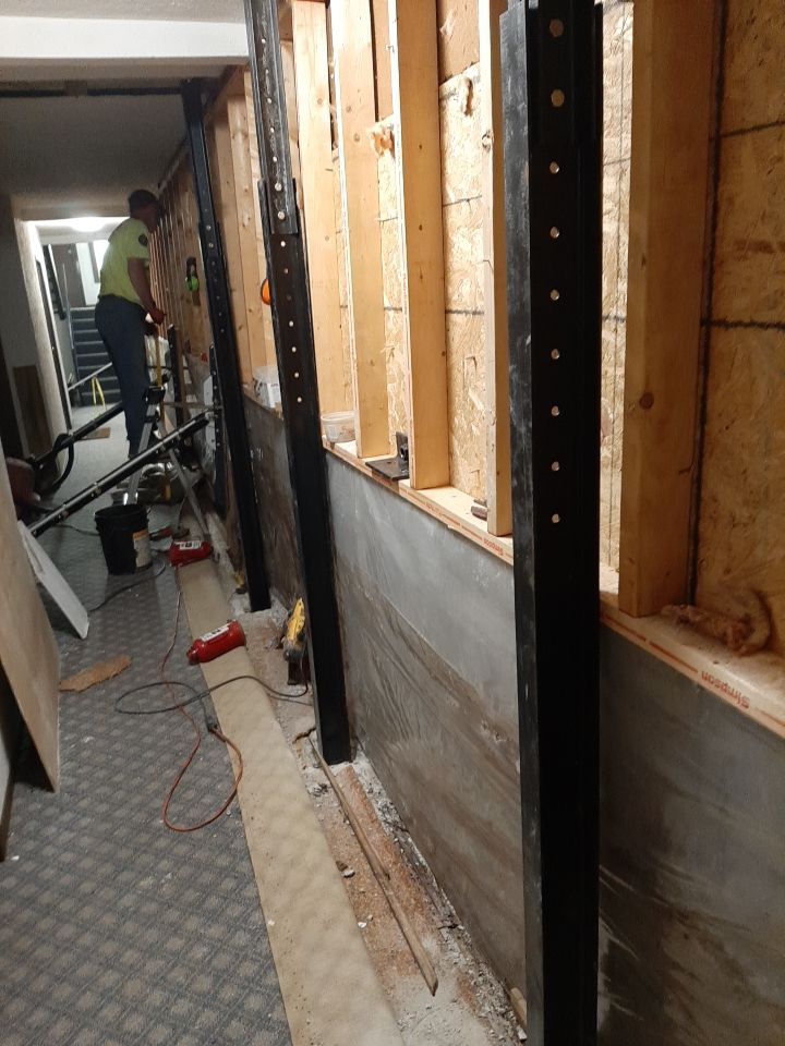 Exterior Deep Waterproofing System with Wall Push Back and Steel Beams Reinforcement by Toledo Basement Repair