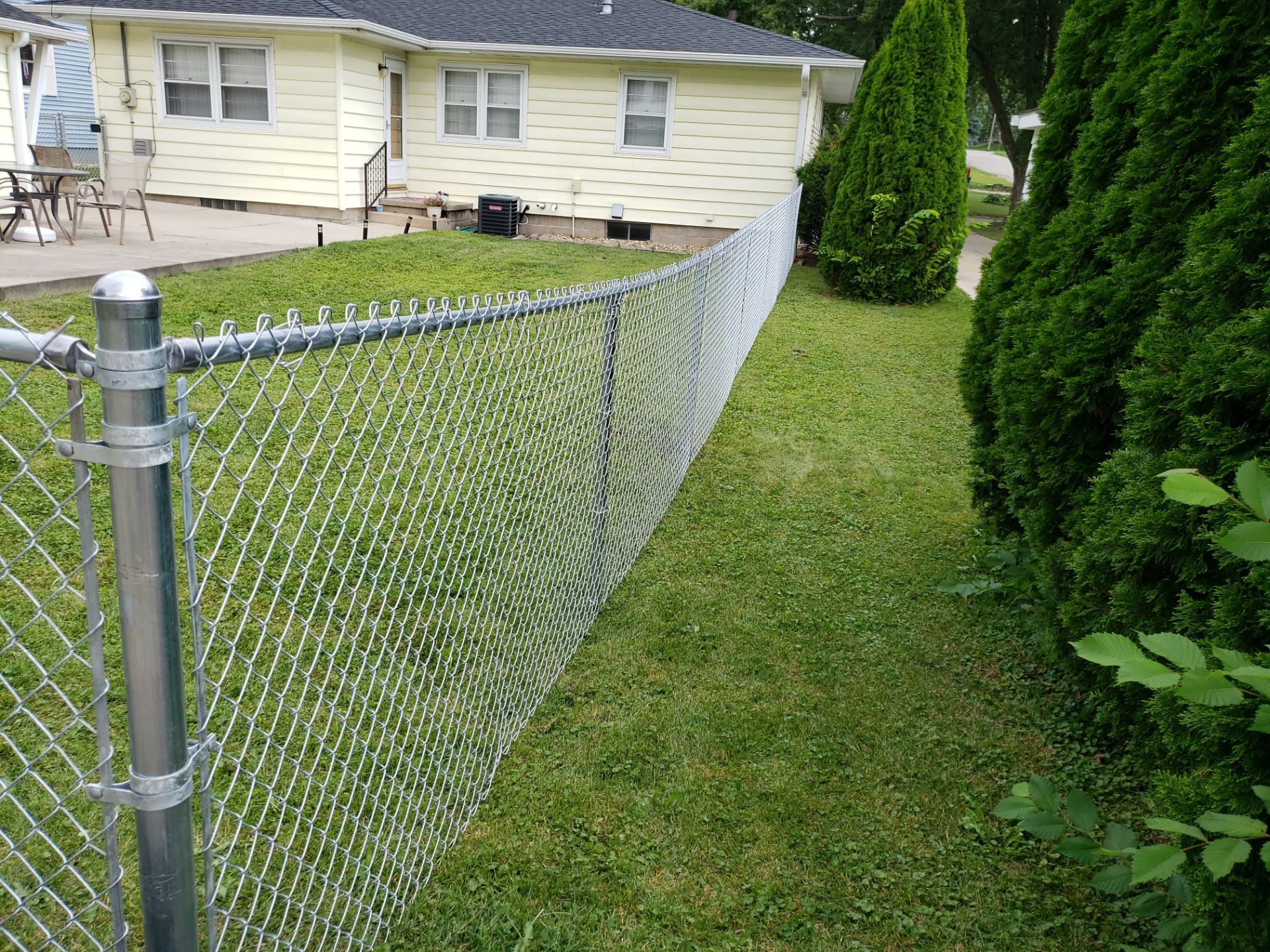 Residential Chain Link Fence and Gate Installation in Waterloo by Perfect Picket Fence and Stain
