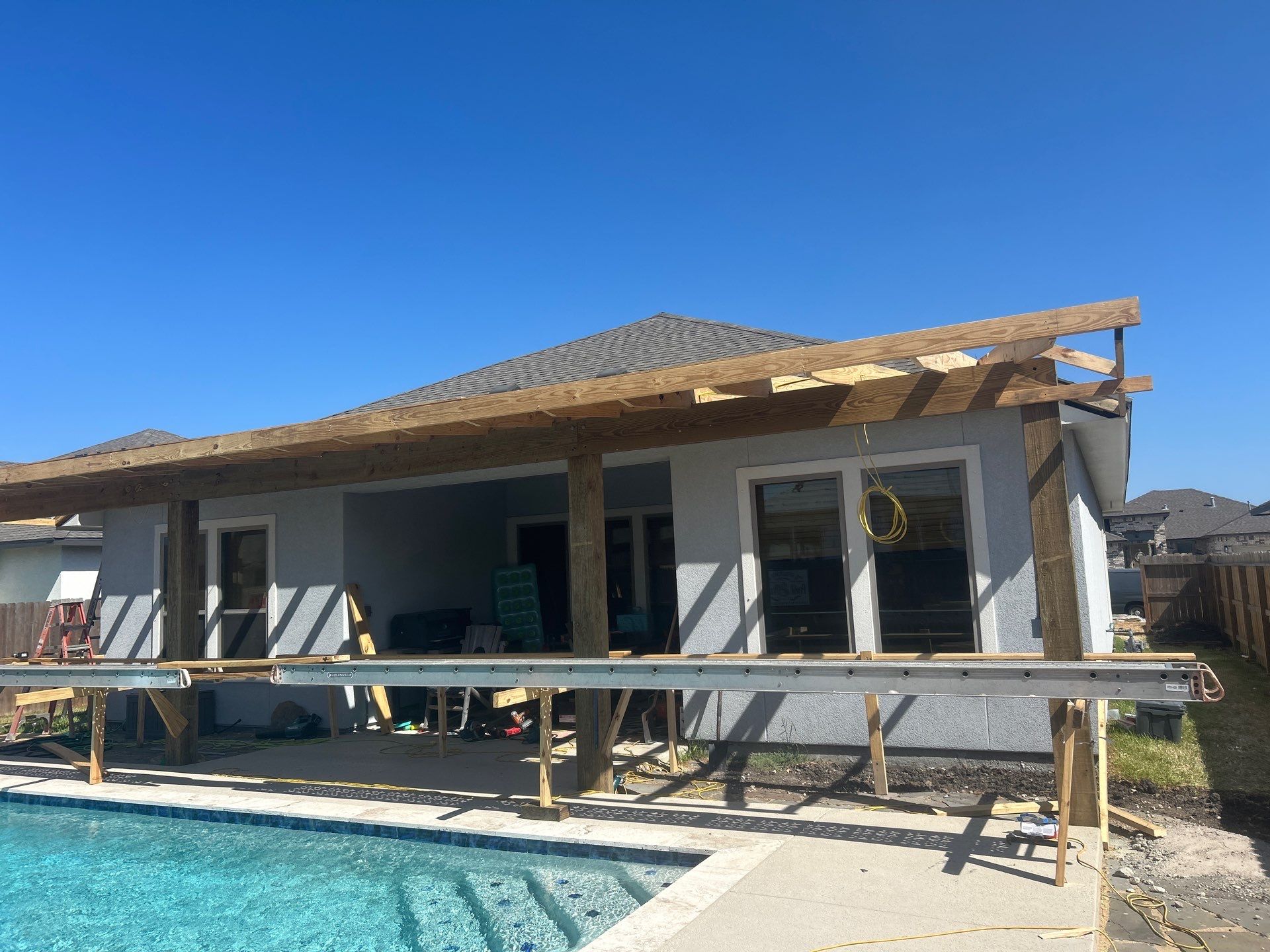 Patio Pool Cover by Bayfront Roofing and Construction