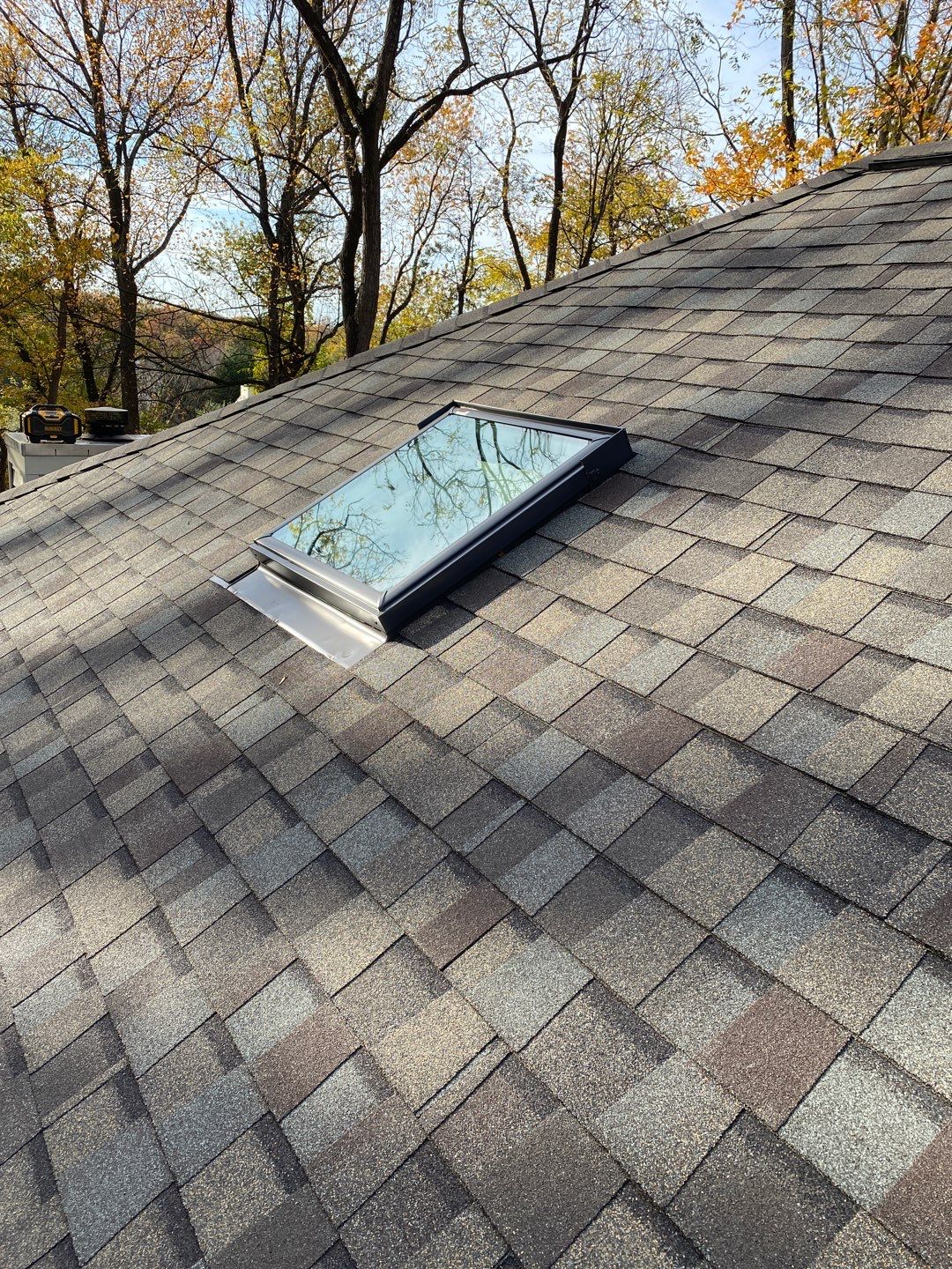 Install new shingles and new skylights  by Alpha Design Services