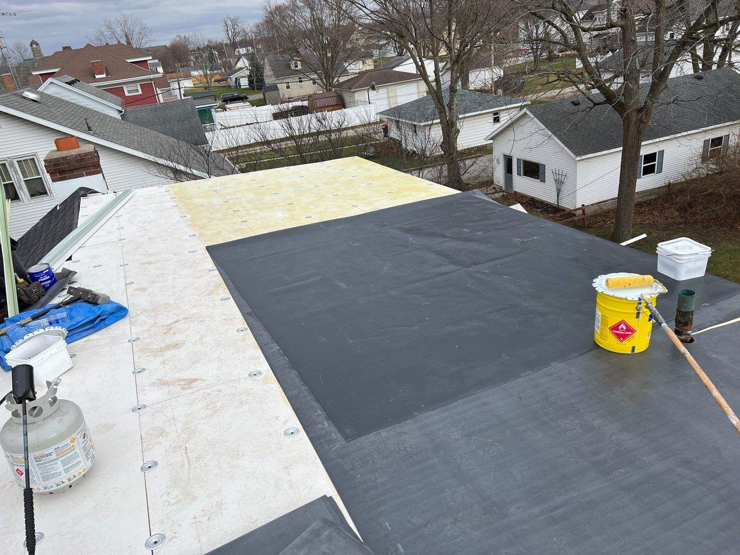 Residential Roofing Installation using 60 mil rubber roof by Nitro Roofing and Construction