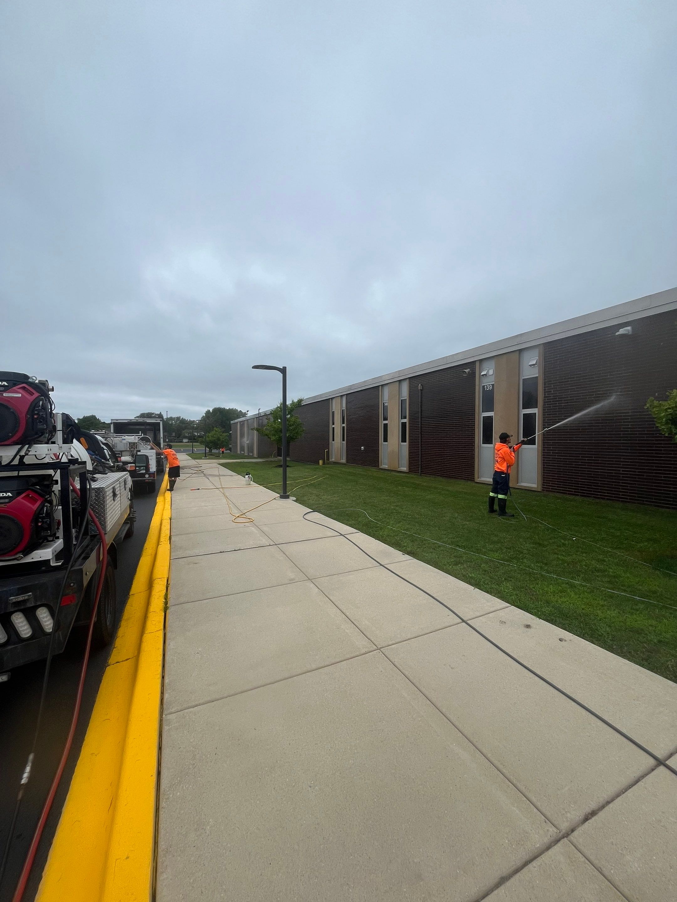 commercial pressure washing using Algaecide, soft wash soap by Northern Power Washing LLC.