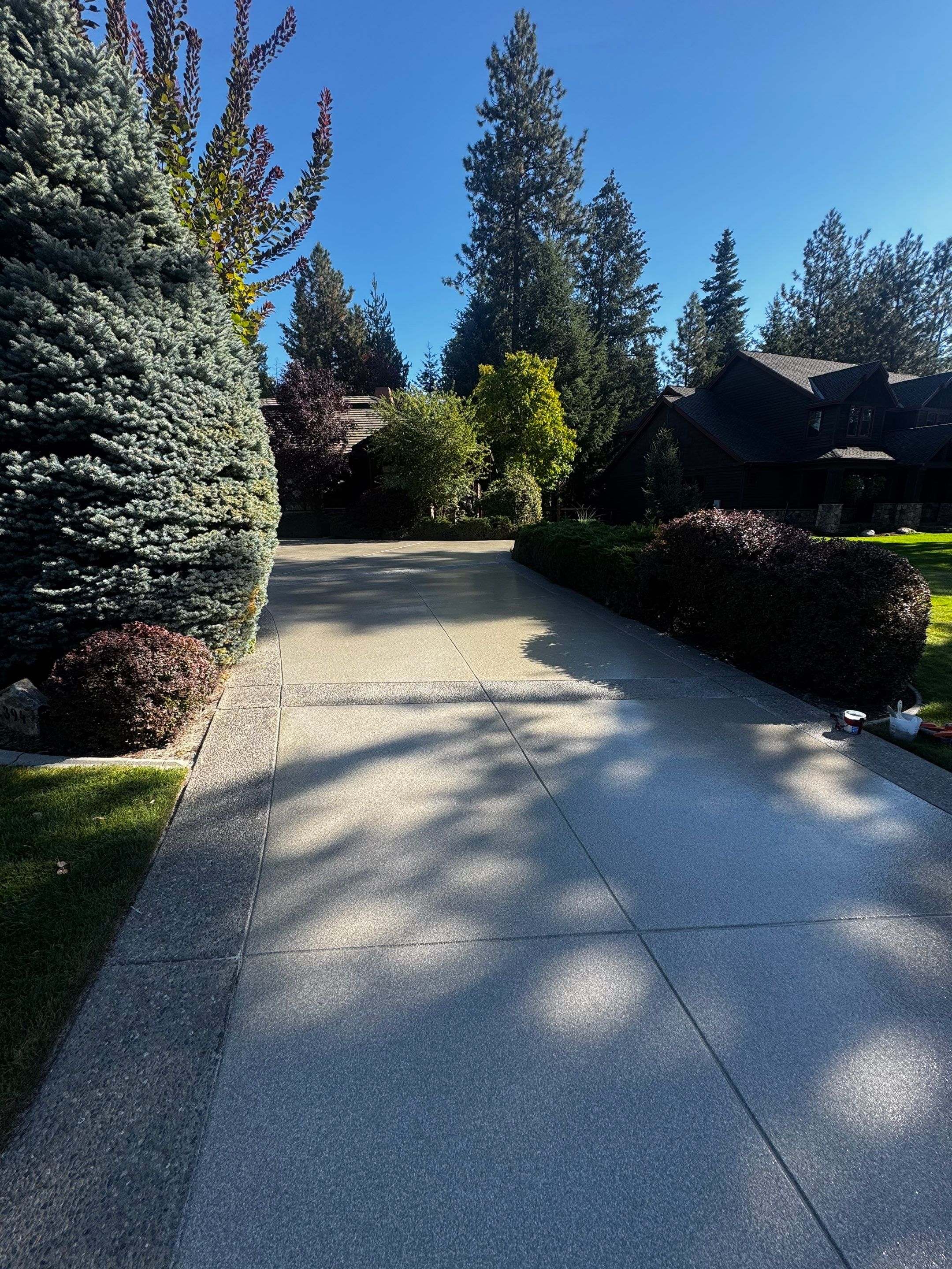 Driveway using Penntek Evolution System and Trail Mix 1/8" Chip by Croc Coatings, LLC