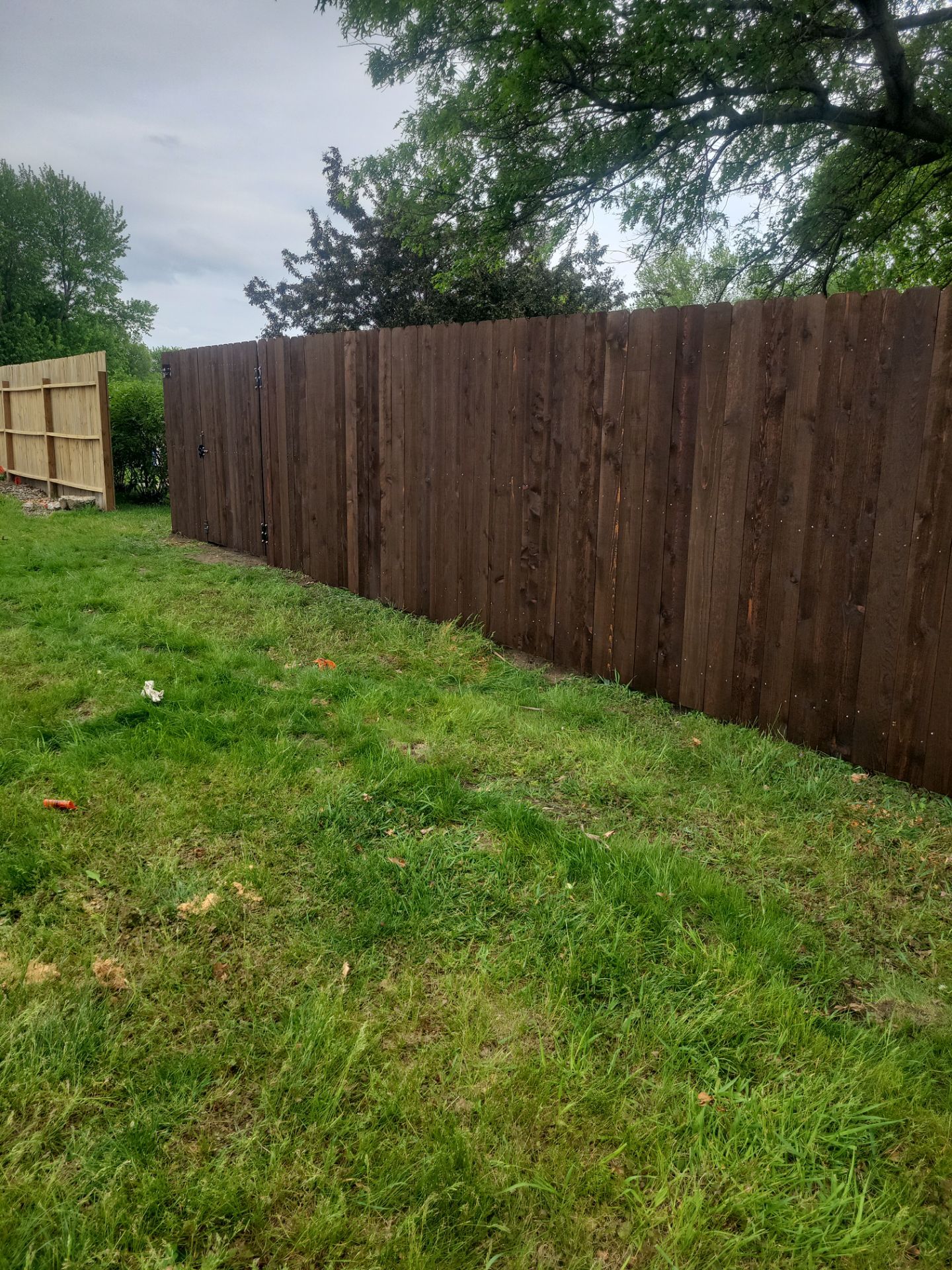 Chain Link and Cedar Privacy in Grundy Center by Perfect Picket Fence and Stain