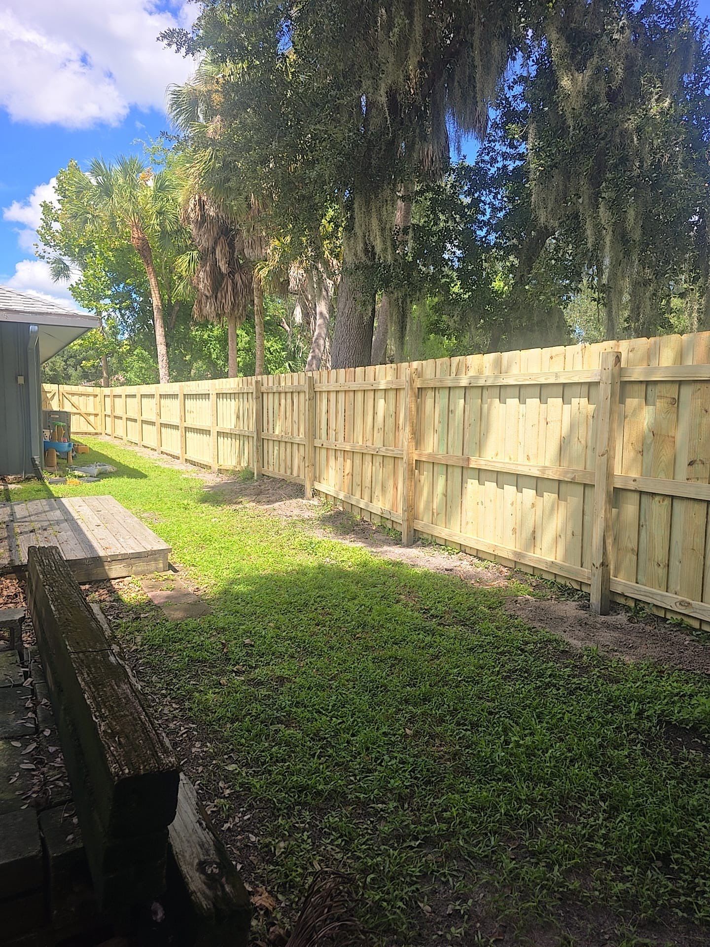 Wood Privacy Fence Installation with Double Gate in Port Charlotte by True Fence LLC