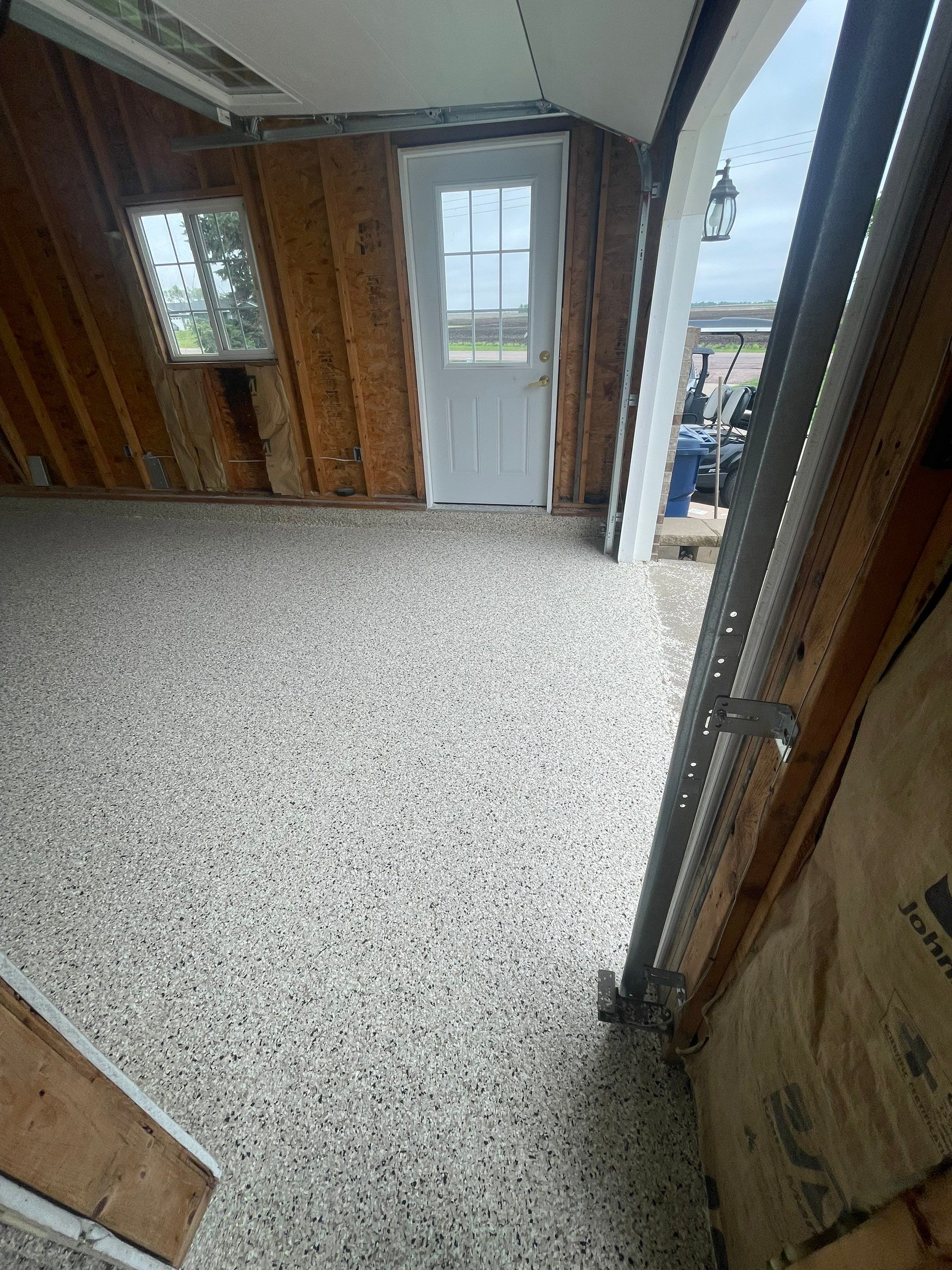 Speckled Epoxy Floor Coating Installation for Centerville Residential Garage by Select Painting, Coatings & Garage Cabinets