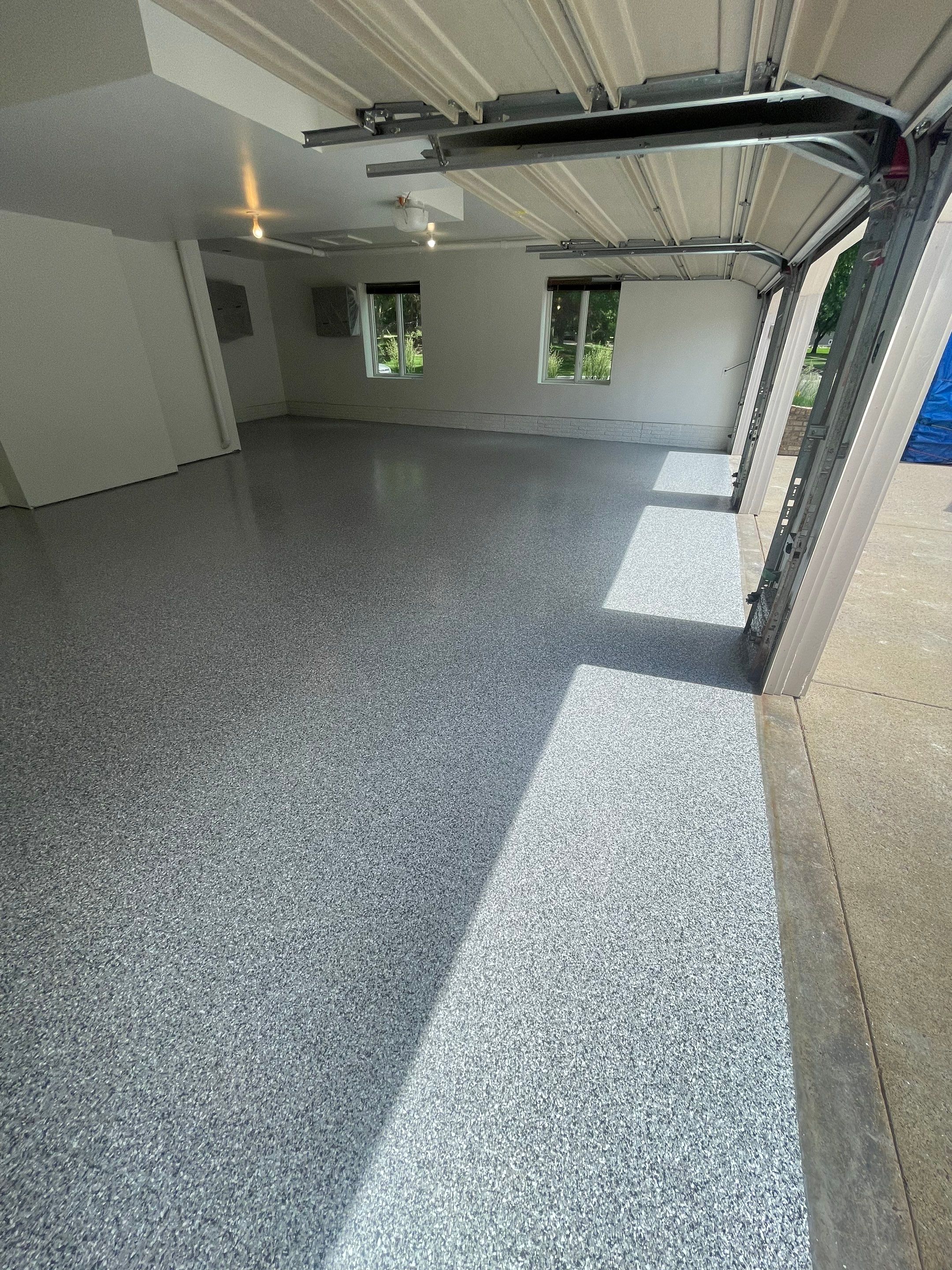 Gray Speckled Epoxy Garage Floor Coating in Sioux Falls by Select Painting, Coatings & Garage Cabinets