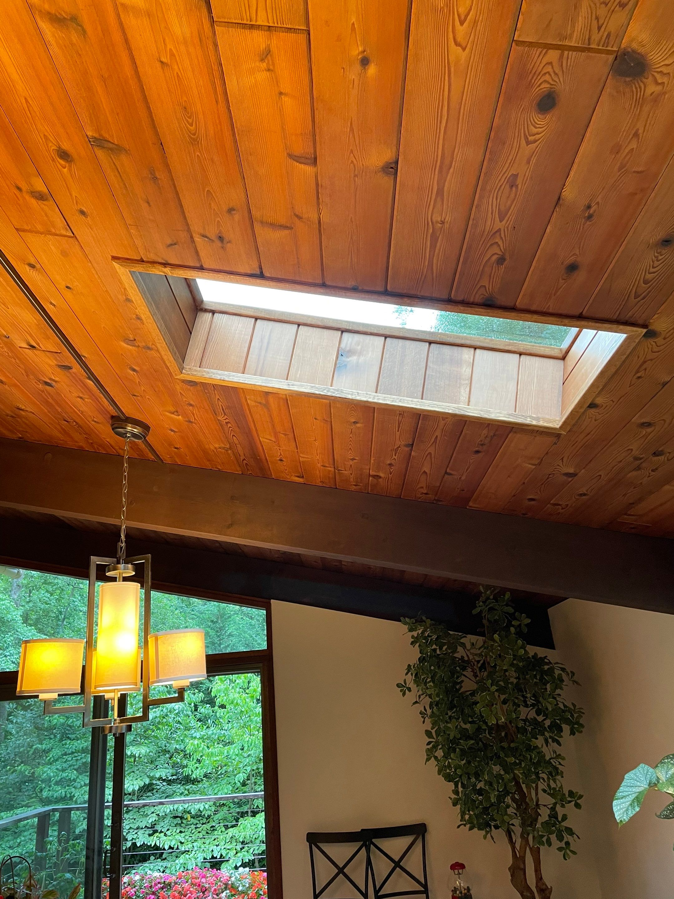 Acorn Deck House Roof Replacement + Skylight Addition by American Home Contractors