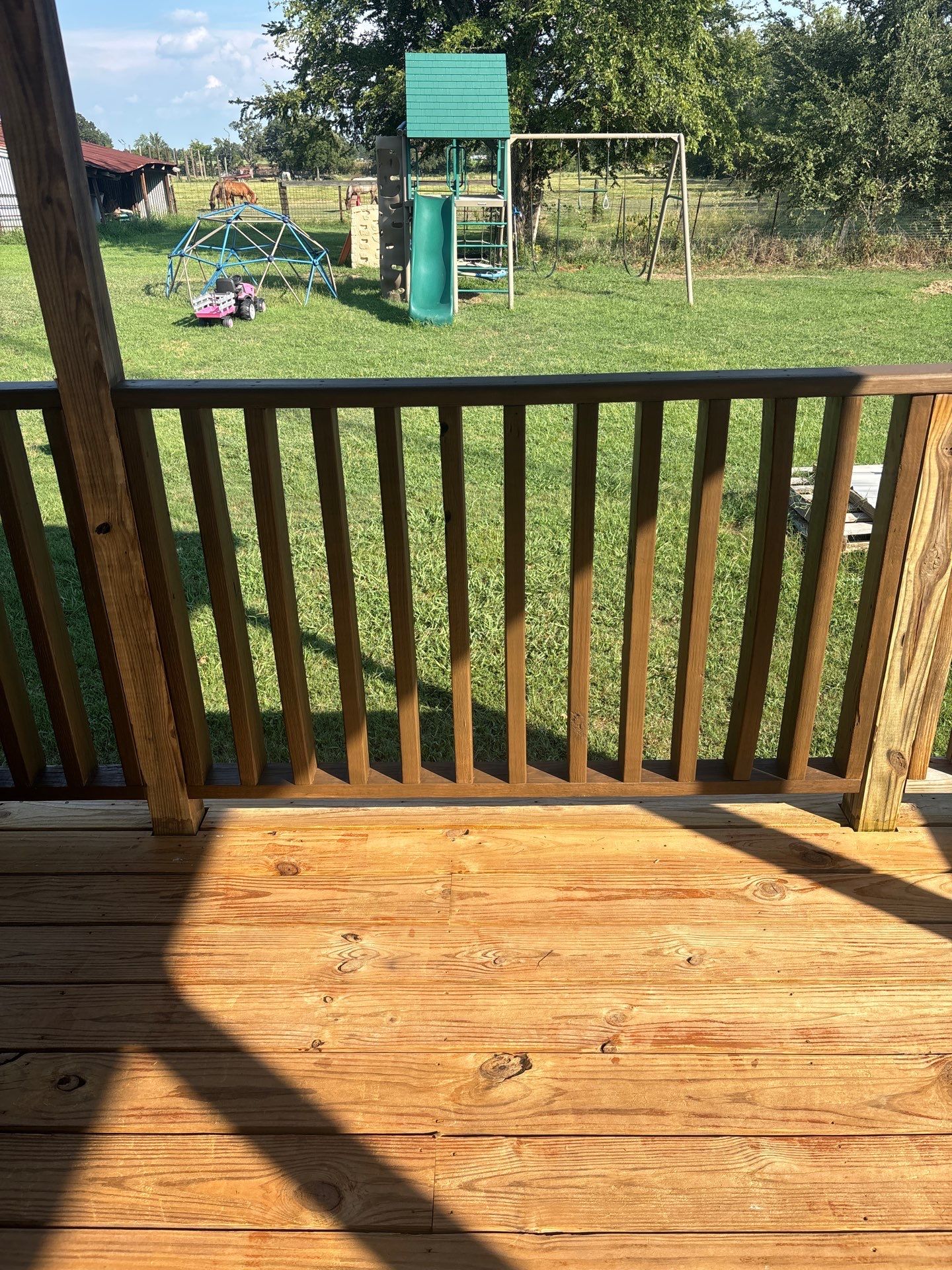 Exterior Painting in Fruitvale, TX | Wood Porch & Home in Deep Navy Blue by Quality Coats Painting
