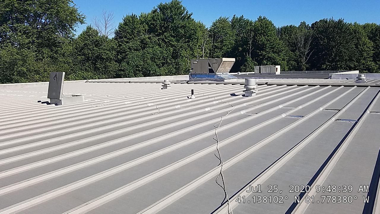 Commercial Metal Roof Coating by Gold Star Roofing LLC