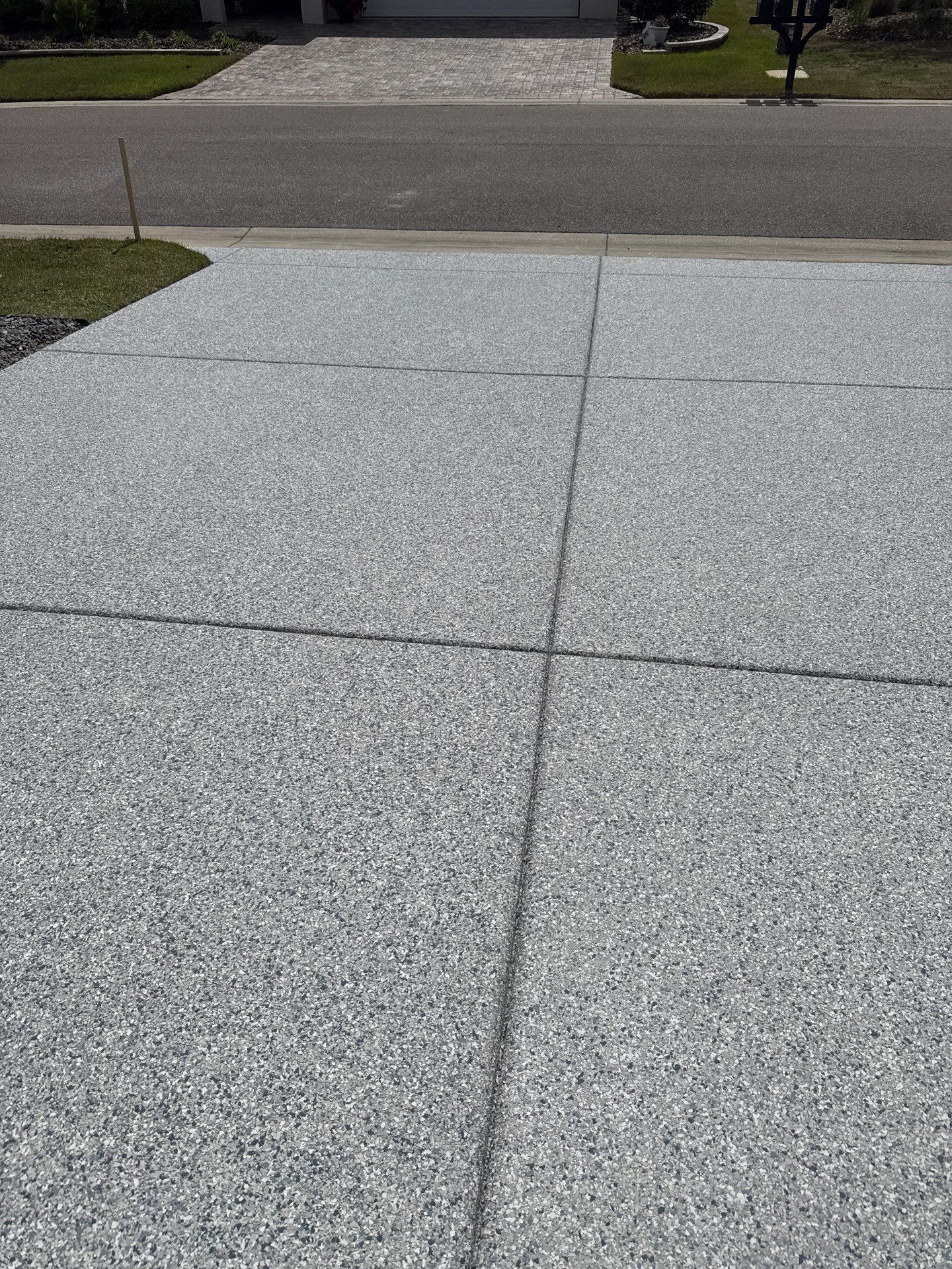 Driveway with Border Slatestone  by Innovative Concrete Coatings 