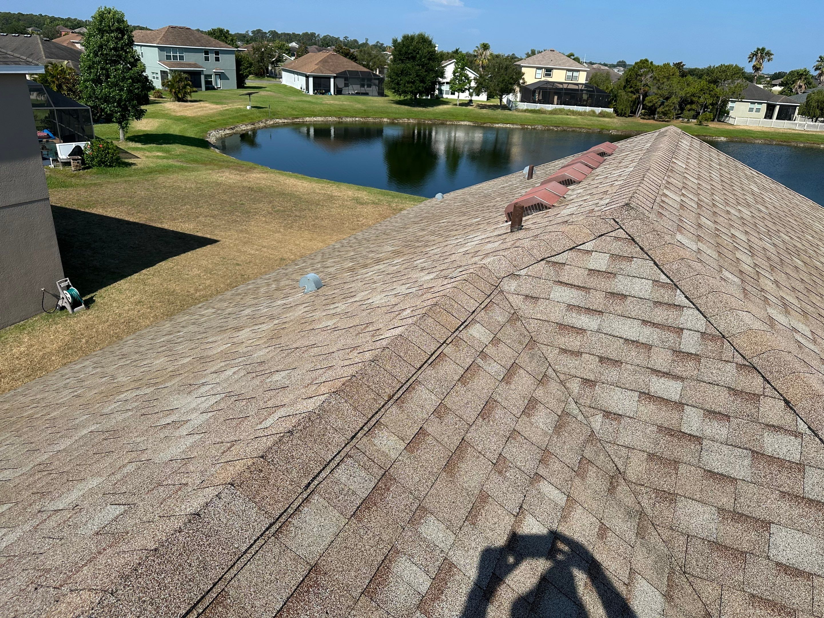 Asphalt Shingle Roof Soft Wash Cleaning & Concrete Pressure Washing in CopperStone Community, Parrish, FL by Sunshine AquaWash