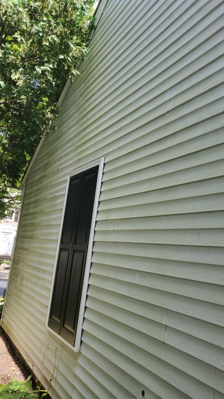 Housewashing  using Algaecide, soft wash soap by Northern Power Washing LLC.