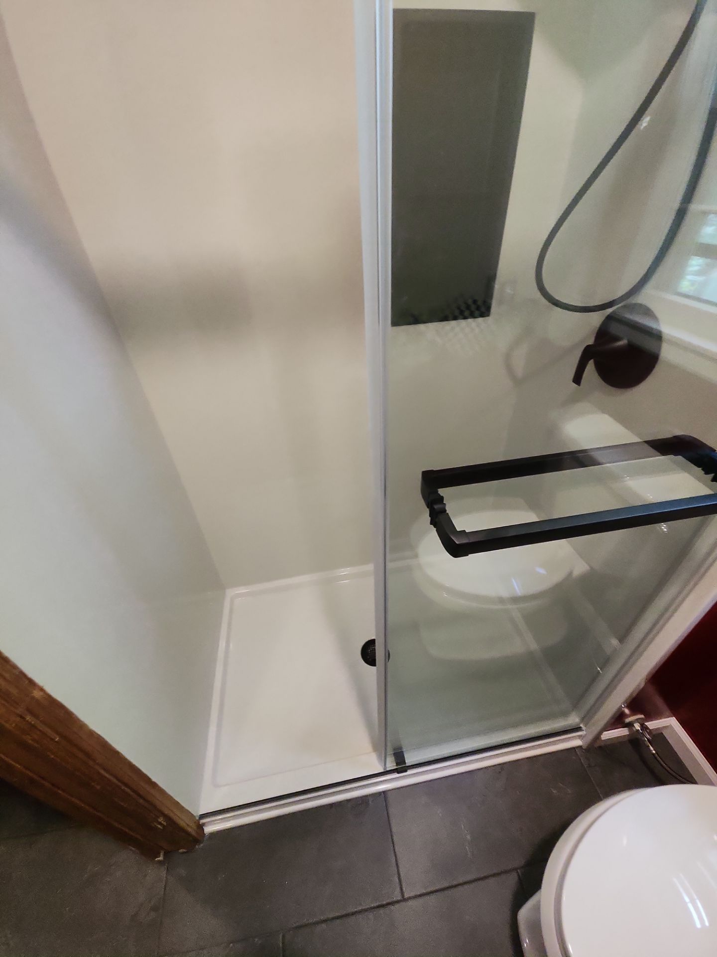 Bathroom Remodel using Tile Floor by The Shower Company
