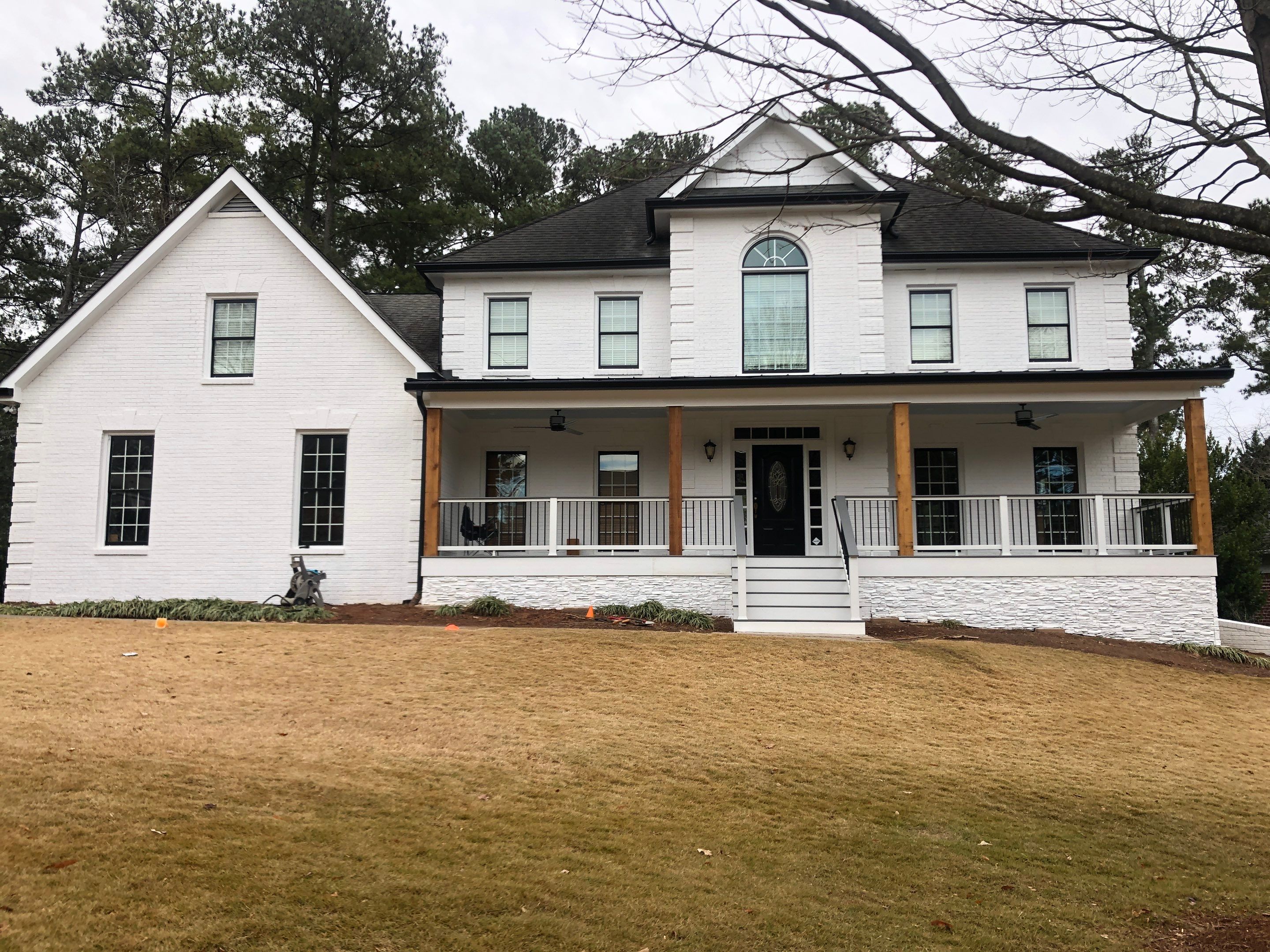 Custom Front Porch Construction with White Railing in Dunwoody by Swift Home Renovations