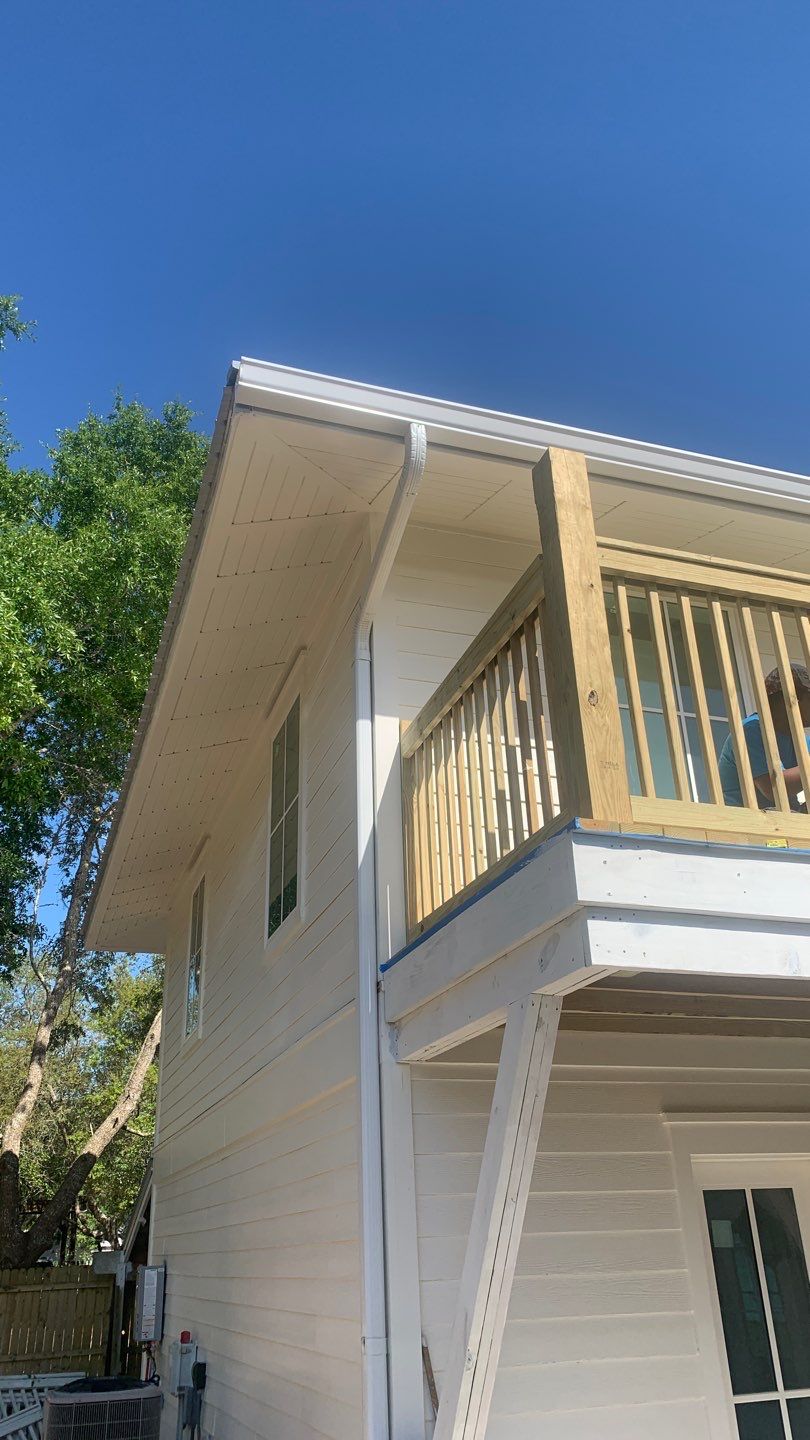 Seamless Gutter Installation Using White K-Style Aluminum Gutters by Gutter Professors