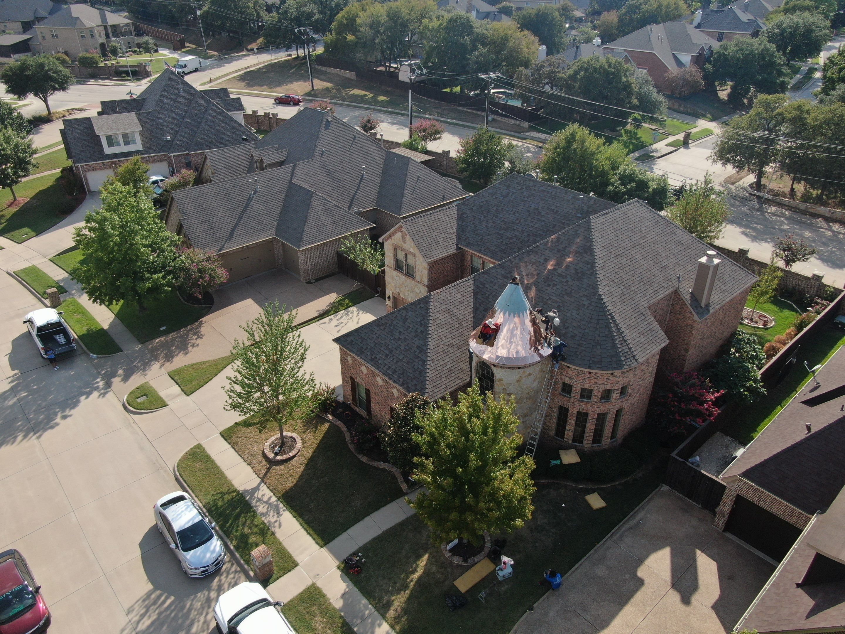 Installing Custom copper turret and Malarkey Vista Class 4 shingles Hail Damage Upgrade by Becker Roofing and Exteriors