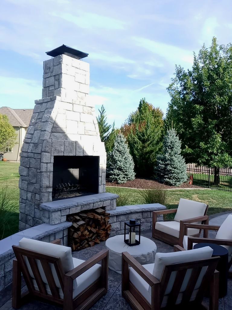 Back Yard Fireplace and Landscape by LAND ESCAPES LLC
