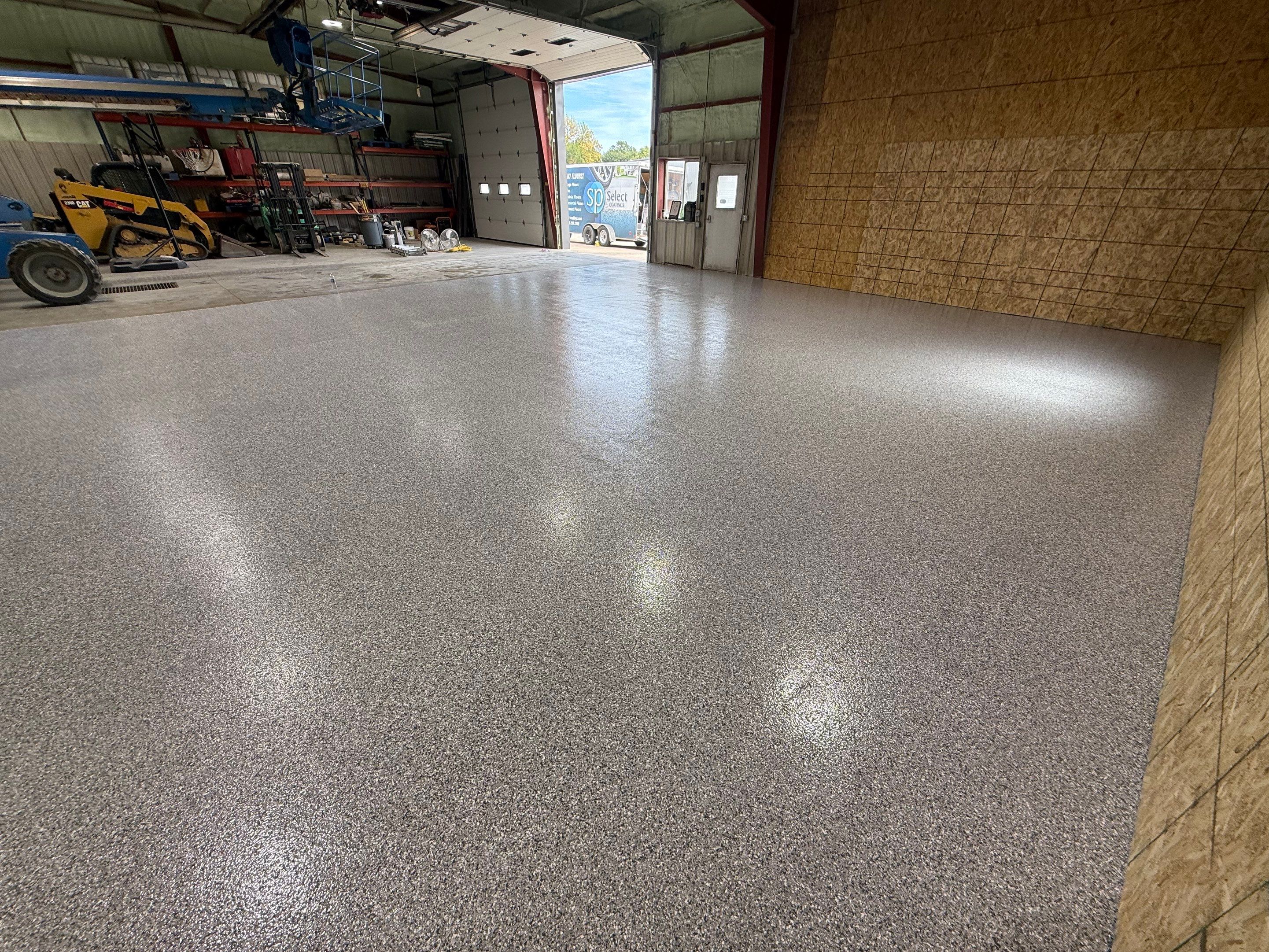 Custom Polyurea Shop Floor with Basketball Court Lines in Rock Valley by Select Painting, Coatings & Garage Cabinets