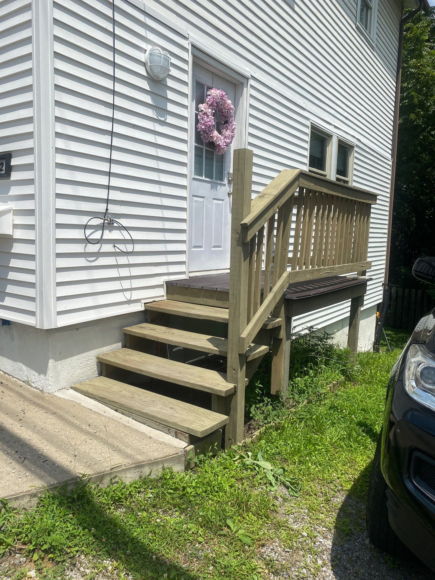 White siding  by Cousins Roofing Siding & Decks