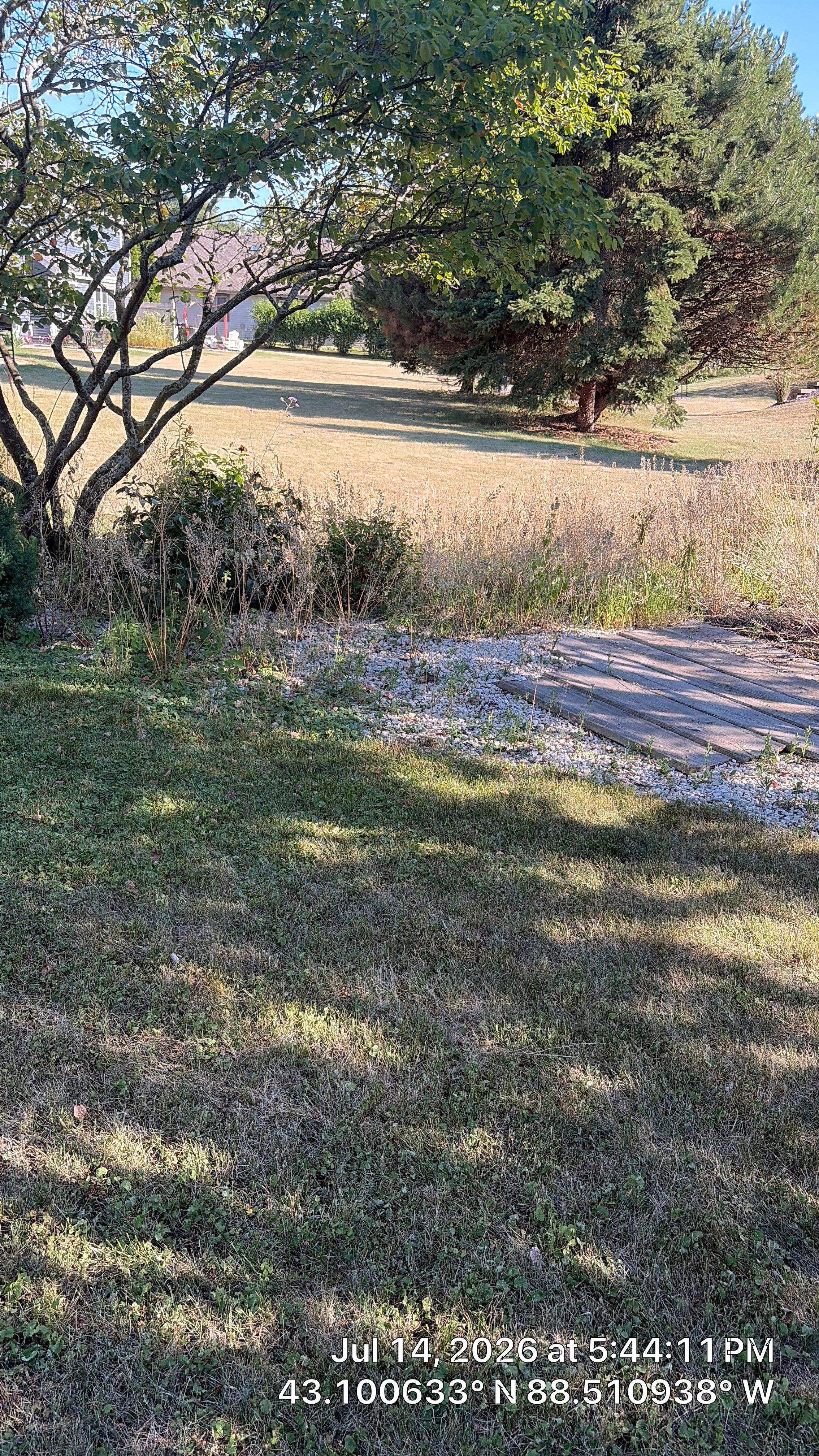 Decorative Stone and River Rock Landscaping for Oconomowoc Residence by CompanyCam Sales Demo