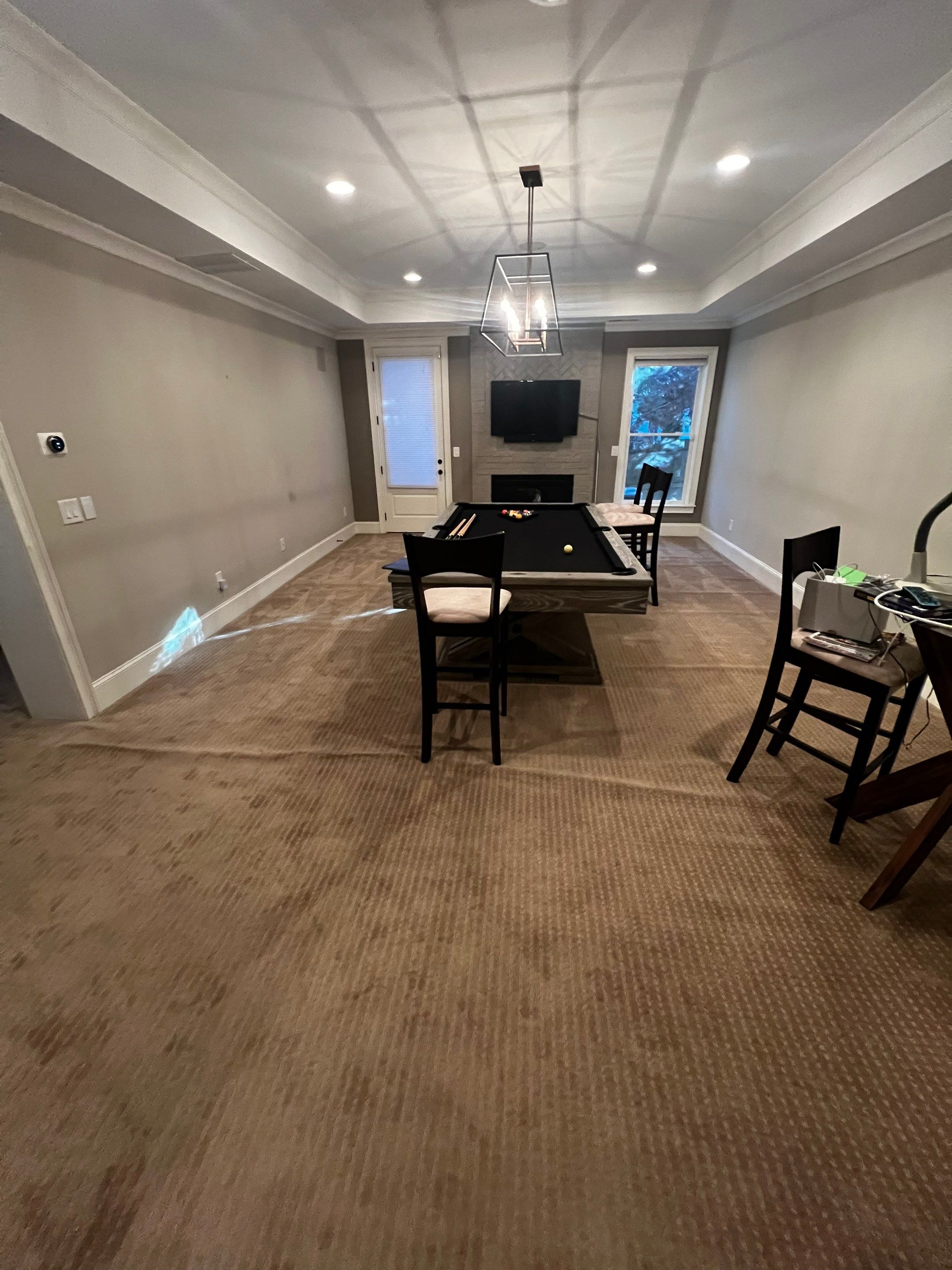 Atlanta Basement Refinishing with Wood Laminate Flooring and Interior Painting by Swift Home Renovations