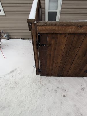 Dark Stained Cedar Privacy Fence and Custom Gates in Cedar Falls