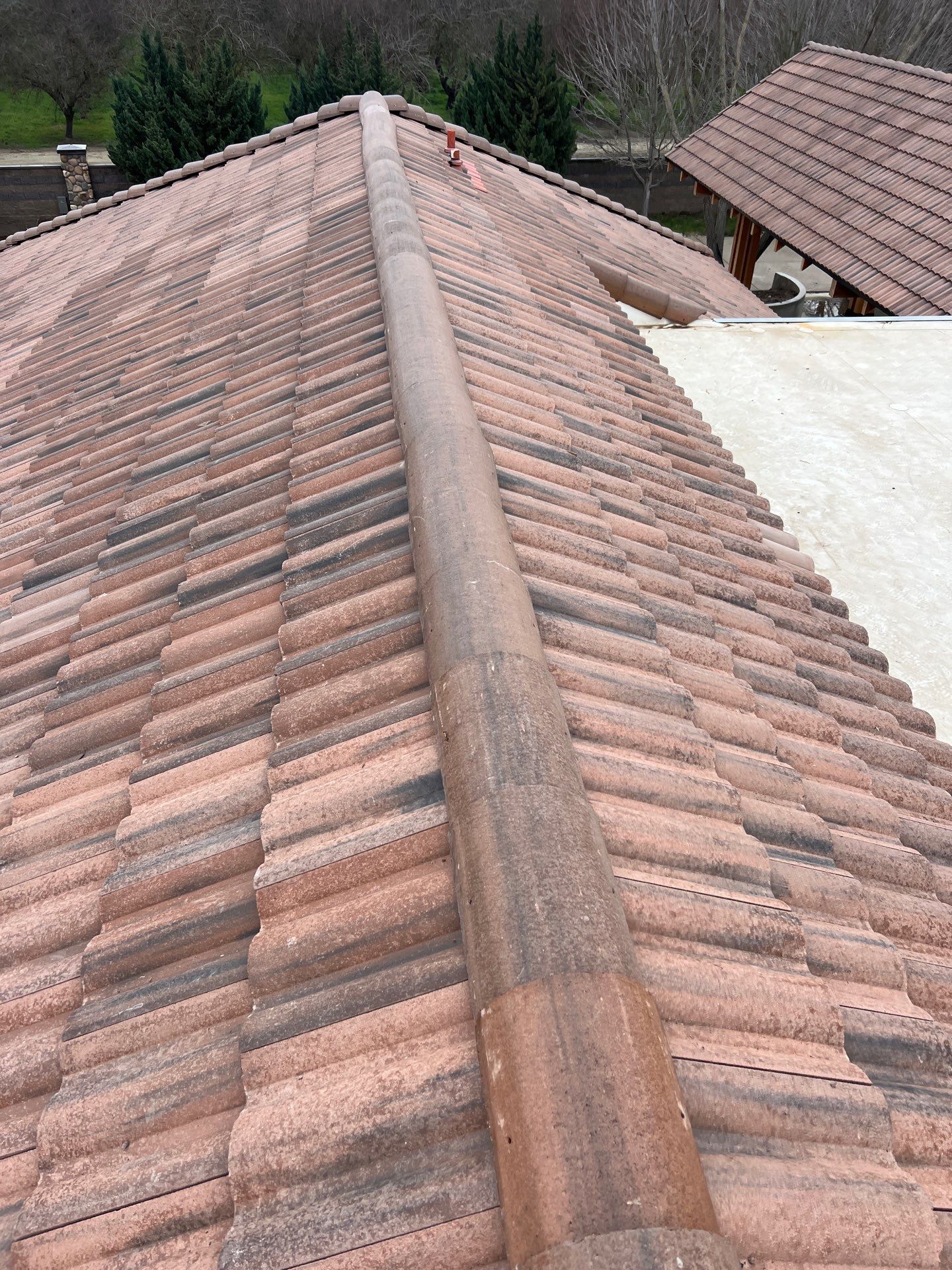 Tile, Metal, and TPO roofing project (new construction) by Straight Edge Roofing Inc